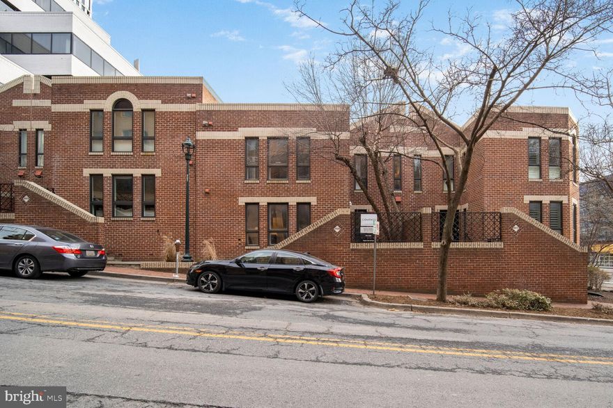 Incredible price for a rare piece of Bethesda Row real estate. A Condo townhouse that lives like an HOA.  No pet restrictions.  No short term rental restrictions, allowing for great flexibility with type of usage. Short term executive, long term lease, or AirB&B it!   And, this place has a super low condo fee.  You get a private Georgetown gated patio all with a walk score of 99!  This townhome offers 2 bedrooms and 1.5 baths on 2 levels.  The main floor has a generous living/dining room with hardwood floors and a convenient half bath, utility/storage closet as well as a coat closet.  The kitchen comes well equipped and has a table space and large window for some nice natural light.  Upstairs you will find a queen sized bedroom with ample built-ins and a walk in closet.  The second bedroom offers built in shelves, closet, all with wood flooring throughout.  There is also a four piece bathroom which has a washer/dryer unit for convenience.   The new owner will be responsible for the roof, windows, all utilities, and all maintenance inside of the gated walls.  Parking is provided in adjoining garage through Colonial parking for around $155 for an unreserved parking spot.  The garage has EV charging stations, bike storage, and private access off Woodmont (at the mailboxes)  for residents.  The Bethesda metro is one block away, the Capital Crescent Trail is 2 blocks away, and everything Bethesda and Bethesda row has to offer is right around the corner!  It doesn't get much better than this!  Townhome living in the heart of the city.