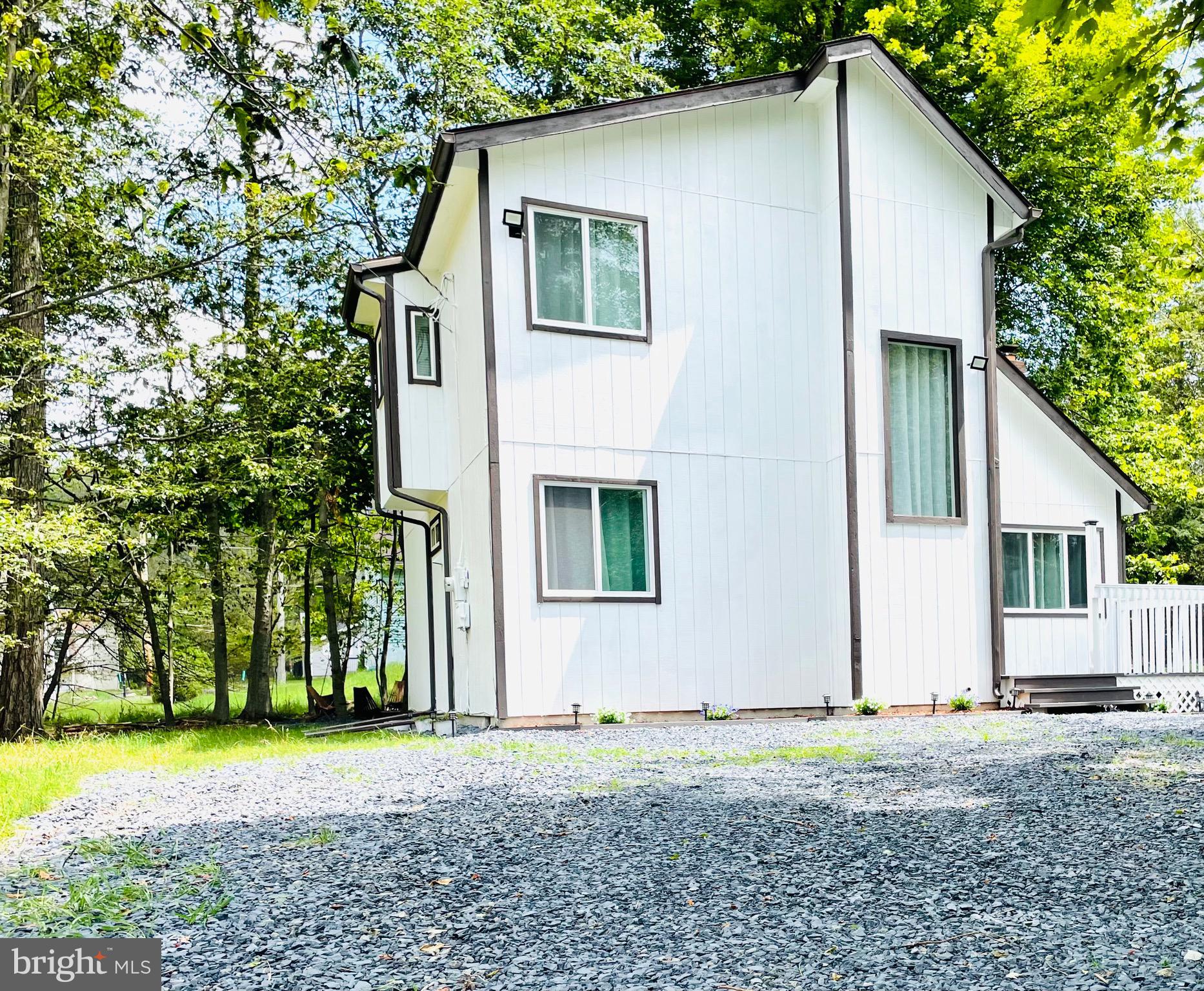 THE SELLER IS OFFERING 1% OF THE SALE PRICE AS A SELLER ASSIST- GREAT OPPORTUNITY TO REDUCE THE BUYER'S MORTGAGE RATE IF USED TO BUY DOWN POINTS!!
FULLY FURNISHED, MOVE-IN READY home located in A Pocono Country Place—a gated, amenity-rich community ideal for year-round living, vacation escapes, or income-producing SHORT-TERM-RENTALS.
Set on a peaceful, wooded lot, this property features soaring ceilings, sun-filled windows, and HARDWOOD FLOORS that create a bright, airy interior. The OPEN-CONCEPT layout includes a white kitchen with ample counter space that flows into the living and dining areas—perfect for entertaining or everyday COMFORT.
Upstairs, you’ll find flexible rooms ideal for bedrooms, home offices, or guest space. Outside, enjoy the privacy and lifestyle perks of a large deck, custom fire pit, and storage shed—everything you need for outdoor living and hosting.
Community amenities include lakes, pools, tennis and basketball courts, playgrounds, a clubhouse, and 24/7 security.
Highlights:
Fully Furnished
Fire Pit
Deck
Shed
Short-Term Rental Friendly
Gated Community with Resort-Style Amenities