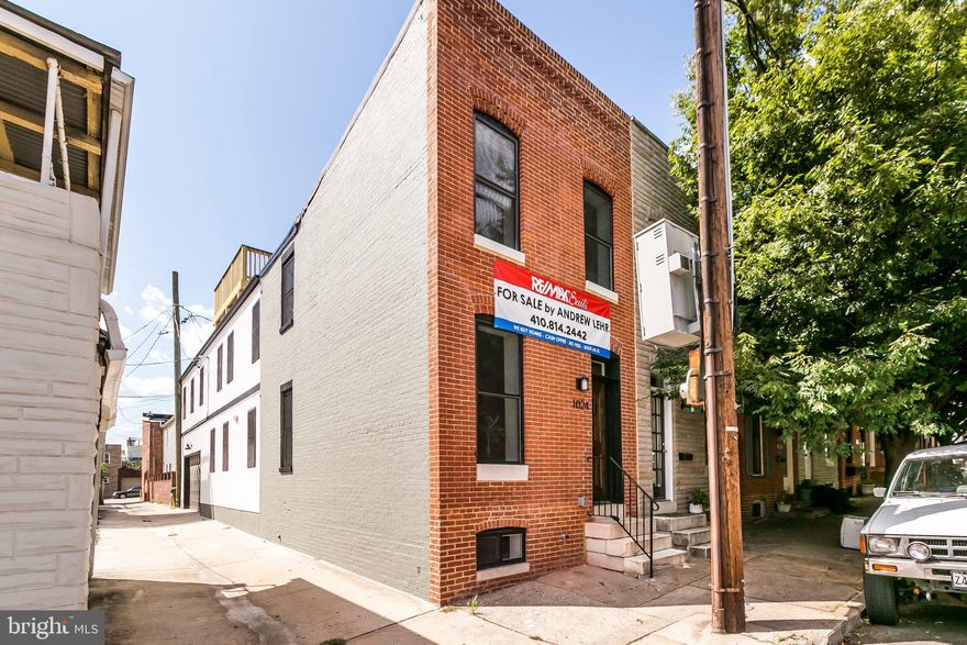 REMARKABLE RENOVATION W/ OVER 2000 SQ FT OF LIVING SPACE & SIDE LOAD GARAGE - nestled just off the O'Donnell Street corridor in A+ Canton location this large end of group light filled home offers hardwood floors throughout, exposed brick & beams, bead board ceiling, shiplap accent wall, large living & dining room leading to a designer island kitchen w/ ss appliances, custom cabinetry, quartz countertops and tile backsplash with under cabinet lighting! Expansive second level offers rare 3 spacious bedrooms above grade, luxurious owner's bath with double bowl vanity & marble accents, full sized laundry room & hallway access to deck!  Finished lower level - this one has it all!