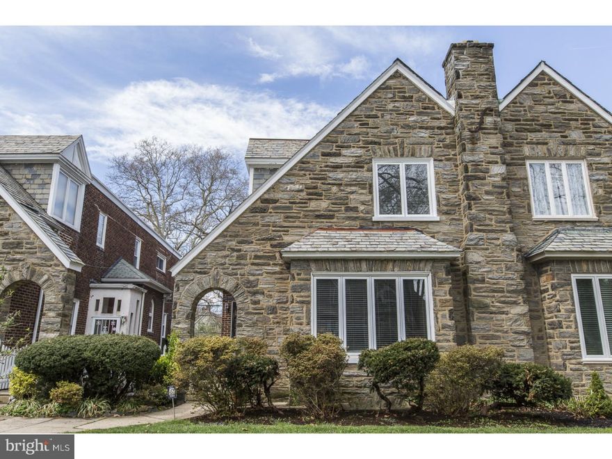 Located on one of Mt. Airy's most desirable streets, this updated 1920's 4 bedroom 2.5 bath stone twin is one not to miss! You will be wowed by the gracious sunken living room with a stone wood burning fireplace.  Enjoy beautiful  hardwood floors throughout, spacious dining room and an updated eat in kitchen. The renovated kitchen offers high end cabinets, tons of counter space and a slider door to the lovely back deck. Upstairs, you will find 4 generous sized bedrooms including a master suite with a full bath, built in closets and drawers and an updated hall bathroom.  The upgrades in this home are endless with central air, NEWER windows, NEW roof, 200 amp electric, and more. Other amenities and features include, a partially finished basement with a powder room, a one car attached garage with interior access and  one car parking.  You will love this tree lined block and this homes close proximity to the train, Germantown Avenue retail/restaurants and much more.