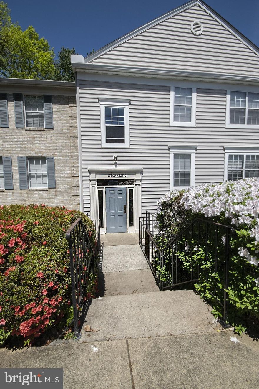 Beautifully Rennovated  3 Bedroom, 2 Full Bath Condo.  Bamboo Floors Throughout, Large Living Room walks out to Patio Backing to Trees.  Enjoy cooking in the Gourmet Kitchen with Granite Counters, and Upgraded Appliances.  Both Baths are Fully Rennovated with High End Materials.  New Widows, Newer HVAC, New Interior Doors, some new paint.  Minutes to Commuter Lots, Shopping, Restaurants, Community Ammenities, with Large Park and Lake,  5 Pools, Marina, Golf Course, Picnic Areas.