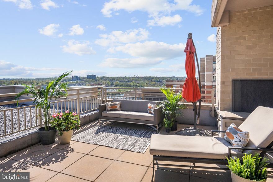 Open Saturday and Sunday, Dec. 13 and 14, 11am-1pm!

Welcome to #1050, a rarely available, stunning two-bedroom, two-bathroom corner condo with one of the largest private rooftop terraces at The Eclipse. This impressive upper floor unit boasts south-facing views of the Potomac River and Potomac Yard, the George Washington Masonic National Memorial, and National Harbor. Brazilian cherry floors are found throughout, while near floor-to-ceiling windows flood the home with natural light. The gorgeous, renovated kitchen features granite countertops, dark wood cabinetry, a beautifully tiled backsplash, and stainless steel appliances; it opens to a unique den space, perfect for an extra dining area or home office. The expansive living area provides ample room for entertaining, and connects to a balcony that overlooks the center courtyard. The primary bedroom has an en suite bathroom that was fully redone and features a double-vanity, jacuzzi soaking tub, and separate shower. Off the primary bedroom is the incredible  rooftop terrace, one of just two this size in the East building. It is large enough to accommodate multiple outdoor furnishings. The second bedroom features a built-in murphy bed and huge walk-in closet, as well as custom window treatments. An in-unit washer/dryer, two assigned garage parking spaces and one storage space complete this special offering.

The Eclipse has on-site professional management, a 24-hour concierge, one of the largest condo pools in the area, a well-equipped fitness center, a rooftop deck, community room, and several outdoor gardens. Conveniently located less than a mile from Amazon HQ2, DCA, and Virginia Tech's upcoming Innovation Campus, the building sits between the Crystal City Metro and Potomac Yard Metro. It provides unrivaled access to some of the best Arlington has to offer.
