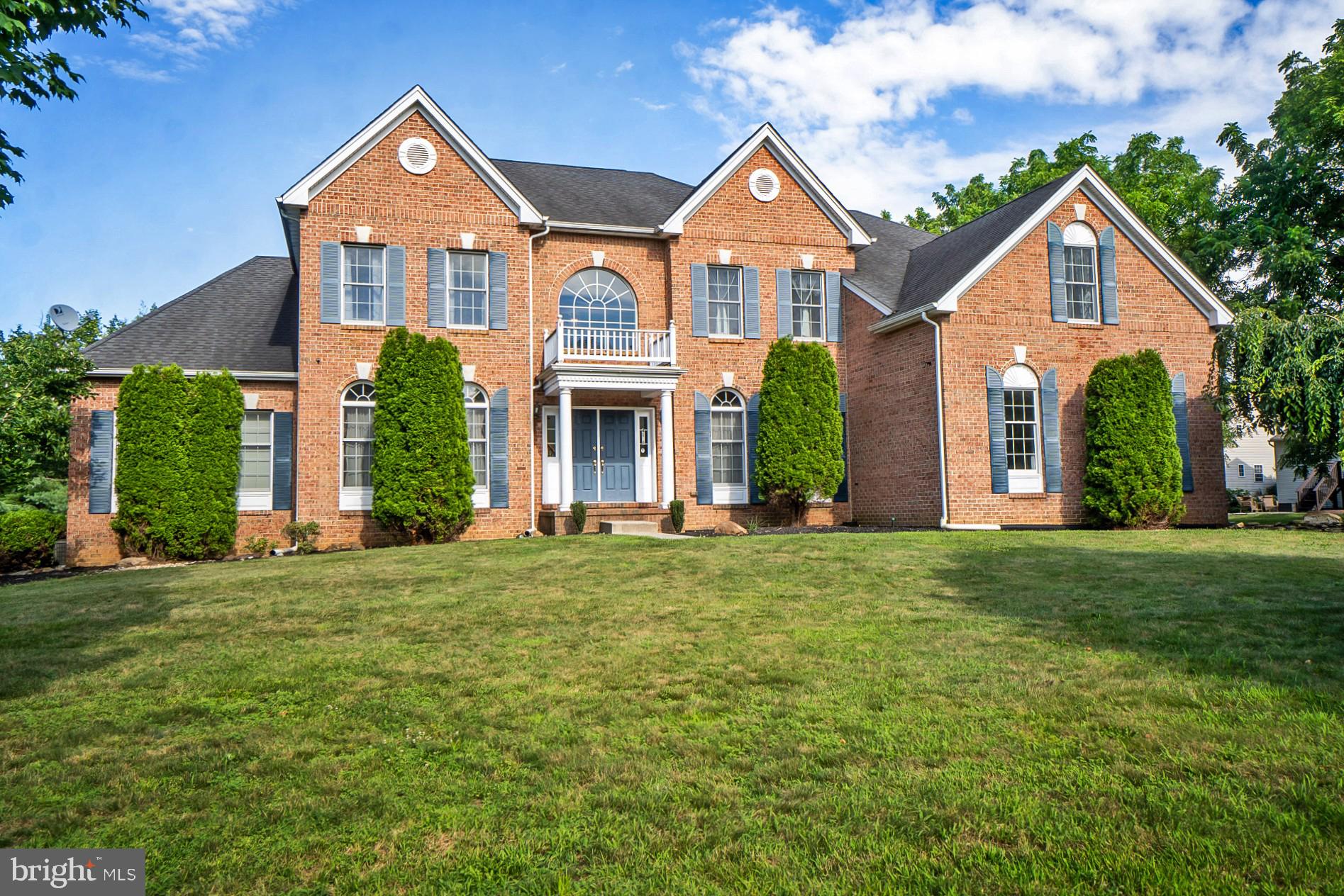 Gracefully set in the sought-after Bethlehem Estates, this stately brick Colonial blends timeless elegance with modern flexibility. It offers over 4,600 sq ft of finished living space, plus a 3,195 sq ft unfinished walkout basement with double French doors...ideal for future expansion. With 5 bdrms & 4.5 ba., the layout adapts beautifully to evolving needs...whether working from home, hosting guests, or enjoying the luxury of space. A full guest wing on the main level includes a sitting room, bedroom, walk-in closet, & full bath...great for multigenerational living. A sweeping staircase opens to a dramatic two-story foyer with hardwood floors throughout the main level. Formal living and dining rooms feature crown molding and tray ceilings. The kitchen includes granite counters, center island & stainless appliances. It opens to a sunny breakfast area & an exceptionally large sunroom with patio access. The family room features 19.5’ ceilings, arched windows, & a brick fireplace. Upstairs, the expansive primary suite includes a sitting area, spacious walk-in closet, and spa bath with walk in shower. One upstairs bedroom is a princess suite with full bath, while bedrooms 3 & 4 are joined by a split-entry bath. A private, tree-lined backyard with a paver patio & 3 car garage is perfect for entertaining...without HOA restrictions. Located in Bethlehem SD near major commuting routes, trails, shopping, schools, and hospitals. This is one you don't want to miss!