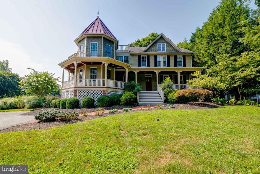 SQUARE FOOTAGE IS INCORRECT!!!  THE CURRENT OWNER ADDED 2200 SQUARE FEET TO THE HOUSE SINCE THEY PURCHASED IN 2005.  EVERYTHING ON THE LEFT OF THE STAIRWAY IN THE FOYER IS NEW.  TOTAL SQUARE FOOTAGE IS ESTIMATED TO BE 5400 SQUARE FEET.  Memories will be made in this one of a kind updated Victorian Beauty which over the years has been host to reunions, graduations, birthdays, holiday gatherings for friends and family, a family wedding, and more.  Classic old world style meets modern convinces in this gorgeous home.  You will fall in love with this well maintained, unique, move-in ready, spacious, and functional home in the heart of Oella, within walking distance of Ellicott City on the Trolly Trail.  Must see to appreciate.  Schedule an appointment with your Realtor to view and make it your own.  Nothing was spared when updating and enlarging this beautiful home.  Plenty of room for everyone with four bedrooms and four and a half baths.  Enter the home from the large wrap-around deck through the original front door with custom stained glass and original hardware into the large foyer with light-colored pine floors and a beautiful stairway to the upper-level.  From the foyer the formal living room is to your right, the kitchen, formal dining room, family room, and a powder room are also accessible.  The formal dining room has more custom moldings to include a coffered ceiling, hardwood light pine floors, access to the kitchen, and french doors to the huge screened-in porch.  Also, the formal dining room has custom wallpaper within several frames which adds to the period of this home.   As you enter the large family room from the foyer you will see a gorgeous fireplace, the original wall from the older part of the home prior to the addition, and an antique door with custom lead glass insert and you will access the large office, mud/pool room with a full bath, washer/dryer, refrigerator and room to store towels, etc for the pool, also access to the large screened porch with a wooden ceiling overlooking the backyard with the backyard kitchen and fireplace and large patio and has access to the formal dining room too.  In the updated kitchen you will have a brick wall behind the gas range, granite counters, stainless appliances, counter seating, and a breakfast nook overlooking the fish pond and backyard kitchen with grills, smoker, a large patio with a large fireplace, great for family gatherings.  The basement access is in the kitchen with stairs to the lower level which has beautiful stone walls and is a great space for workout equipment and more, it also has a lot of storage.  The third level access is either from the foyer or the kitchen, there you will find the large/private owners suite with a fireplace, large private bath with an antique claw-footed tub, beautiful dual sink vanity, and separate tiled shower.  Also in this suite is a large walk-in closet and a laundry room.  There are two more bedrooms on this level and two more full baths, one is a hall bath, the other bath is an ensuite bath in the front bedroom, there's also another family room on this level.  The fourth level is the fourth bedroom.  The outdoor space is inviting to all, with the heated pool with a fire pit and gazebo, the large patio area with an outdoor kitchen and large fireplace, great for family/friends gathering.  The driveway is large and can park many cars and the large yard to the left of the driveway is perfect for parking overflow when entertaining.  The yard has been professionally landscaped and beautiful.   This one-of-a-kind home located in historic Oella is a must-see, it will not disappoint.