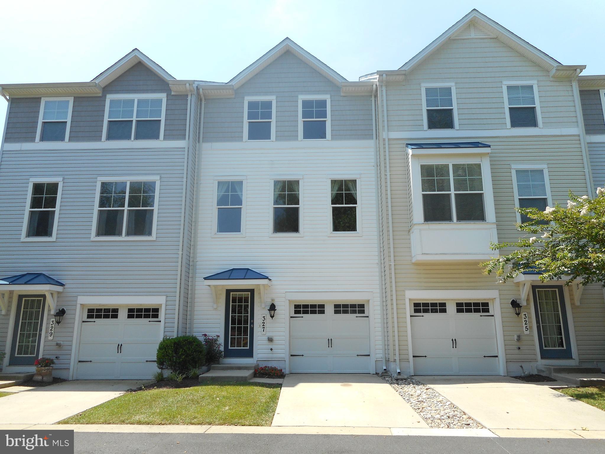 Live like you're on vacation in this beautiful townhome with a view of the pool! Spacious and better than brand new with new carpet, granite counters, attached garage,deck overlooking the pool.