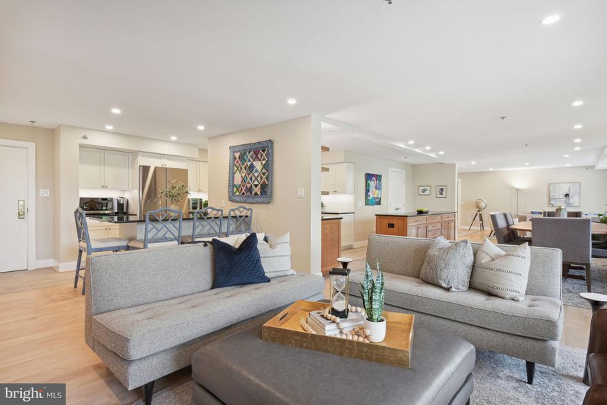 Introducing THE CARLETON in Chevy Chase, a luxurious residence conveniently situated near the Friendship Heights Metro, Whole Foods, and The Collection. Renowned for its exceptional staff and friendly community, The Carleton offers full-service amenities, including a gym, heated pool, and 24-hour front desk, all in a pet-friendly environment.
Completely renovated in 2022, this exquisite condo boasts 3 bedrooms or 2 and a den, 2 full baths, and 2 half baths, spanning over 2600 square feet by combining two units. Step onto the spacious balcony, perfect for enjoying your morning coffee or unwinding with an evening drink. Inside, hardwood floors, dual HVAC zones, and dimmable recessed lights create an inviting atmosphere. The expansive open layout encompasses multiple living areas, a large dining space, and access to the balcony. Custom remote control window treatments, ceiling fans, and additional sound attenuation insulation add to the comfort and tranquility of the home. The well-appointed kitchen features subway tile backsplash, black granite counters, ample cabinetry, under cabinet lighting, and a long island with abundant storage and serving space. The owner's suite is a retreat in itself, with a spacious sitting area, a large walk-in closet, and a beautiful owner's bath. This exceptional residence also includes 2 reserved garage spaces and 2 storage spaces. With its thoughtful design, modern upgrades, and prime location, this home at The Carleton offers a truly luxurious and convenient lifestyle.