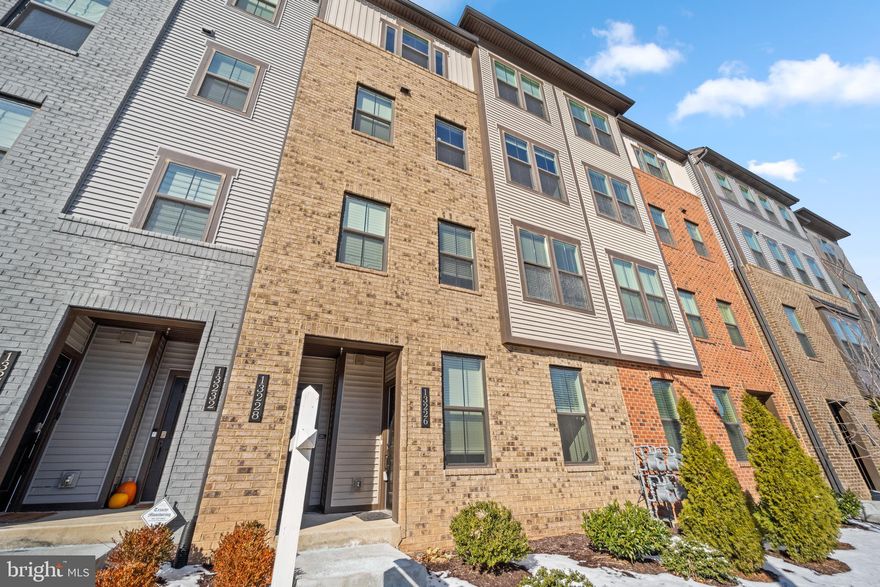 This spacious and well-maintained two-level condo offers comfortable living with modern amenities. Large open main level with huge island perfect for the gourmet cook and for large gatherings!  The kitchen has upgraded stainless appliances and tons of cabinets providing lots of storage. The large living/dining area and family room are adjacent to the kitchen making this a great living space.  Just off the family room you can enjoy a morning coffee on the large covered deck with gas fireplace.  The upper level features three generously sized bedrooms and two full bathrooms.  The primary bedroom is spacious with tray ceiling, recessed lights, large walk in closet and large en suite bathroom. . Beautiful wood floors extend throughout the main level, adding warmth and character, while plush carpeting offers comfort upstairs.  The condo includes a one-car garage with additional storage space, along with a dedicated laundry room that also offers extra storage. Thoughtfully designed for both function and style, this home provides everything you need for modern living, with plenty of room to grow.  Great location too- convenient to Dulles Toll Rd and Rt. 28.  Small orderly pets (dogs, cats, caged birds, aquarium fish) are allowed by the Condo Association. 2 pet limit. Don't miss the opportunity to make this stunning condo your new home!