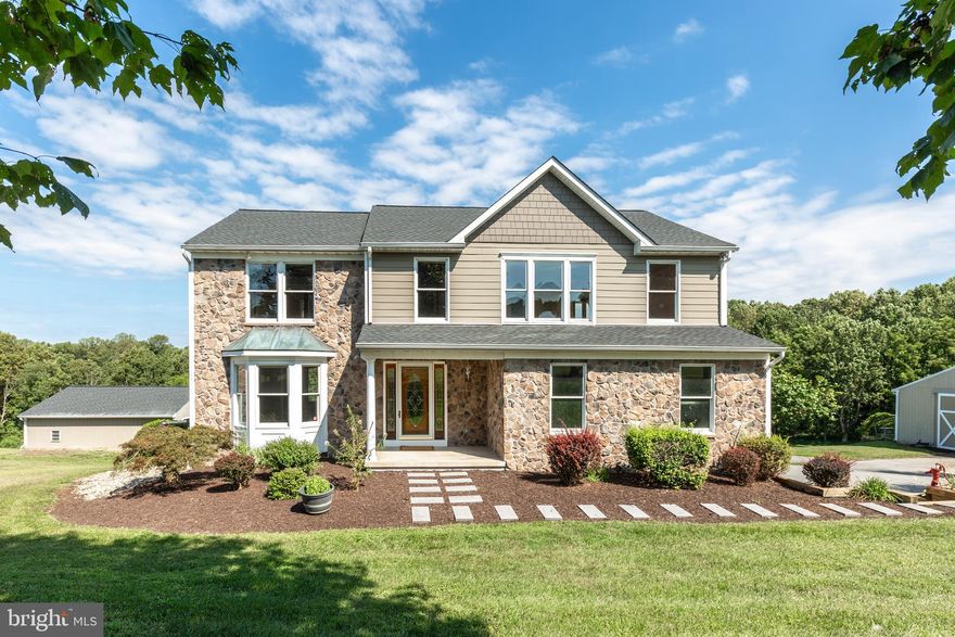 Stunning 14 acre farmette! Discover a rare gem just minutes from Westminster and Eldersburg! This magnificent  property on almost 14 acres is a horse lovers paradise, offering expansive fields, enjoy peaceful woods and private trails all on your own property. The impressive 40x 72' barn is well equipped with four stalls, a washroom, a tack room, an arena and a paddock making it an ideal setup for equestrian enthusiasts. There is a large attached 2 car garage plus  another detached 24x24 garage.
Step inside to find  5 bedrooms, 3.5 bath home with hardwood floors on main and bedroom levels , leading you to the BRAND NEW chefs kitchen with white cabinets and quartz countertops. Also, a brand new luxurious primary bath and new architectural roof was just installed for added peace of mind! The Hardie  siding is more durable than vinyl ! For added convenience the home features two laundry areas on the first and second floor! The finished walkout  Basement with bedroom and full bath gives endless possibilities for private space and entertaining ! Enjoy the tranquil creek, explore the historic stone foundation and abundant wildlife makes this property more than a home- its a life style. Whether you're an equestrian, a hobby farmer, or simply seeking space and serenity, this property delivers unmatched beauty, functionality and charm. Don't miss your chance to own this one of a kind estate!