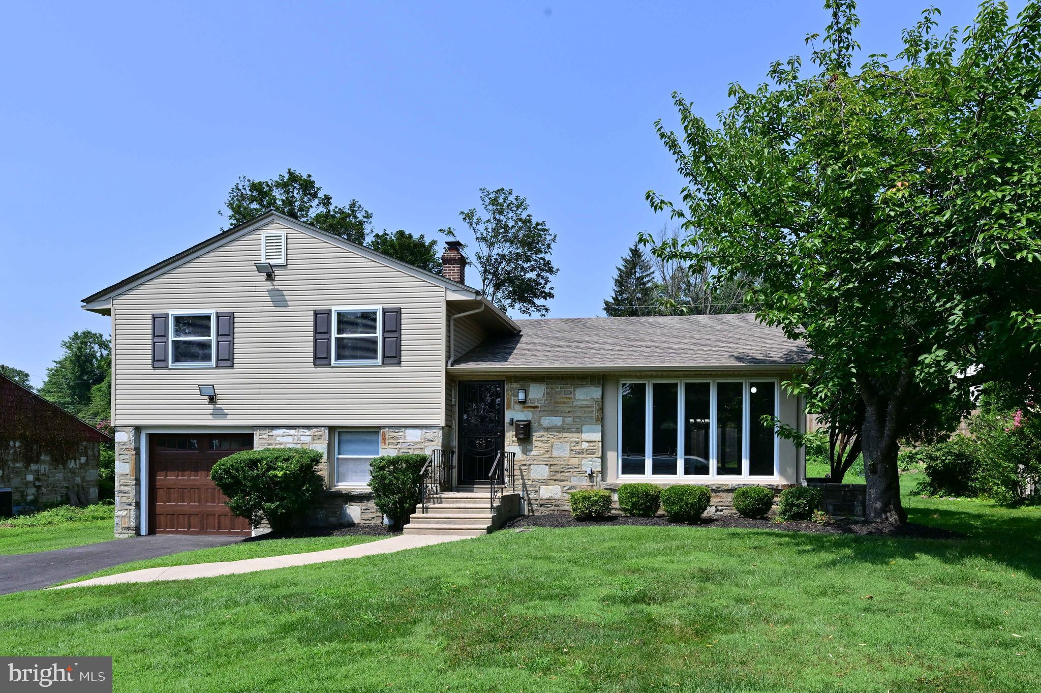 Welcome to this beautiful unique 3 bedroom 2 1/2 bath remodeled split level home in the much sought after subdivision of Twickenham Village. The living room is open to the dining room which opens to the all brand new kitchen with beautiful white shaker cabinets and quarts countertops. All brand-new top of the line Stainless Steel appliances to include the Gas Range, Microwave oven, Dishwasher and Refrigerator. From the kitchen step down to an extra-large finished lower-level family room with a walkout to the back yard. Lots of light coming from the many windows giving the family room an even larger feel. There is a powder room on this level for your guest. A convenient laundry area with brand new washer and dryer, is adjacent to the mechanical area. The upper level has 3 nice sized bedrooms with 2 full baths including one bath as an ensuite. The bedrooms have plenty of storage. From the hallway, there is access to an attic that is vented from the roof and cooled down by an attic fan. This disbursement of heat will help preserve the roof. The home has all new windows, and on the main level there are beautiful extra-large, floor to ceiling new casement windows. These crank out for your ease, comfort and convenience, providing a wonderful cross breeze to feel the outside air.
The home sits on a beautiful lot that is approximately ¼ acre and has many recent upgrades on the exterior such as a newer roof, siding, gutters, and downspouts. There are several exterior flood lights triggered by motion for your safety and convenience. The driveway is newly paved and long enough to fit 4 cars. The beautiful brand-new garage door with windows completes the curb appeal of this home.
Just a short walk to the Glenside Train Station. The Keswick Village, the township library and community pool, ballfields, Chestnut Hill shops and Restaurants, as well as the PA Turnpike, are just a short drive away.