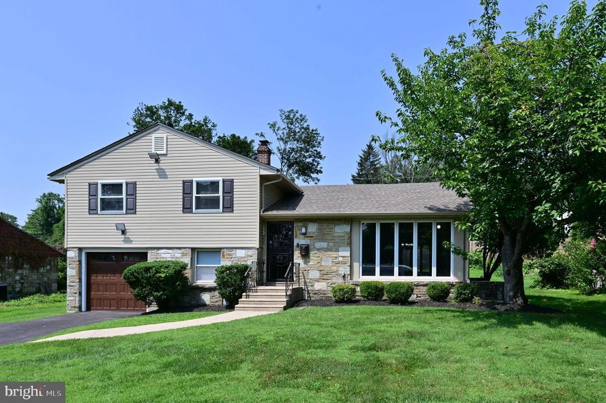 Welcome to this beautiful unique 3 bedroom 2 1/2 bath remodeled split level home in the much sought after subdivision of Twickenham Village. The living room is open to the dining room which opens to the all brand new kitchen with beautiful white shaker cabinets and quarts countertops. All brand-new top of the line Stainless Steel appliances to include the Gas Range, Microwave oven, Dishwasher and Refrigerator. From the kitchen step down to an extra-large finished lower-level family room with a walkout to the back yard.  Lots of light coming from the many windows giving the family room an even larger feel. There is a powder room on this level for your guest. A convenient laundry area with brand new washer and dryer, is adjacent to the mechanical area. The upper level has 3 nice sized bedrooms with 2 full baths including one bath as an ensuite. The bedrooms have plenty of storage.  From the hallway, there is access to an attic that is vented from the roof and cooled down by an attic fan. This disbursement of heat will help preserve the roof.  The home has all new windows, and on the main level there are beautiful extra-large, floor to ceiling new casement windows.  These crank out for your ease, comfort and convenience, providing a wonderful cross breeze to feel the outside air.  
The home sits on a beautiful lot that is approximately ¼ acre and has many recent upgrades on the exterior such as a newer roof, siding, gutters, and downspouts. There are several exterior flood lights triggered by motion for your safety and convenience.  The driveway is newly paved and long enough to fit 4 cars. The beautiful brand-new garage door with windows completes the curb appeal of this home.  
Just a short walk to the Glenside Train Station. The Keswick Village, the township library and community pool, ballfields, Chestnut Hill shops and Restaurants, as well as the PA Turnpike, are just a short drive away.