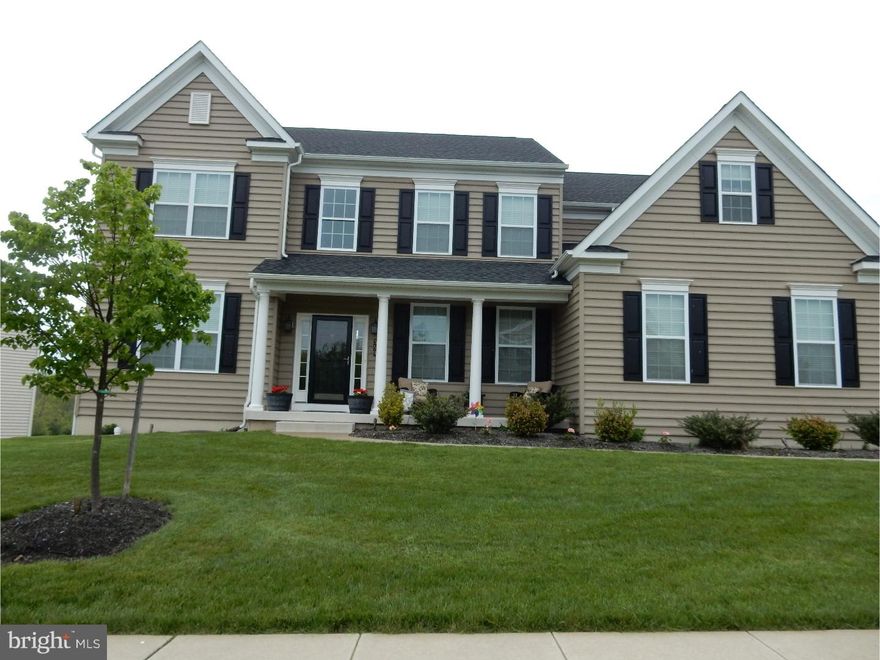 This amazingly spacious 4BR, 2.5BA colonial is better than new construction! Situated on a corner lot, this Covington Country Estate model in the Villages at Country View is loaded with builder upgrades and add-ons! Your tour of over 3300 square feet of living space begins as you step into the 2-story Grand Foyer with turned oak staircase with pine risers. On the left is a bright formal living room with crown molding. To the right is the formal dining room with tray ceiling and crown molding. Moving through the foyer, you'll see the 2-story family room which has a gas fireplace with slate hearth and surround, and an abundance of windows for natural light. To the left is an office/study and a half bath with pedestal sink. On the opposite side of the family room is a fantastic gourmet kitchen with Level 3 granite counters and Travertine back splash, stainless appliances, 42' cabinets, under counter lighting, center island with pendant lighting, butler's pantry, walk-in pantry and an expanded breakfast area with skylights and sliders leading to the back deck. Just beyond the kitchen is a large laundry/mud room with garage entrance. Upstairs you'll find a dreamy master suite, 3 impressive bedrooms and a hall bath. The master bedroom will delight you with its double doors, tray ceiling, recessed lighting, and owner's retreat. The master bath has upgraded tile in the shower and on the floor, a separate toilet room, a 5' stall shower, double sinks, and a linen closet. The master bedroom walk-in closet is a closet lover's dream come true with separate areas. The upstairs hallway is a catwalk which overlooks the family room and foyer. The full, unfinished walkout basement has plumbing roughed in for a full bath and can be finished to your liking for added living or entertainment space. Out back at ground level, there is a propane fire pit surrounded by a stamped concrete patio. There are stunning views from the 2nd story TimberTech composite deck which offers tons of space for outdoor entertaining. Illuminate the home at night with 'up lighting'. The attached 2-car garage has a recently installed floor protector. Added bonuses include off-street parking for 4+ cars, an upgraded lighting package, including dimmers on most light switches, a new storm door with hidden screen, neutral colors throughout, 4-inch base molding and 2-piece crown molding in many rooms. Put this one on your short list today!