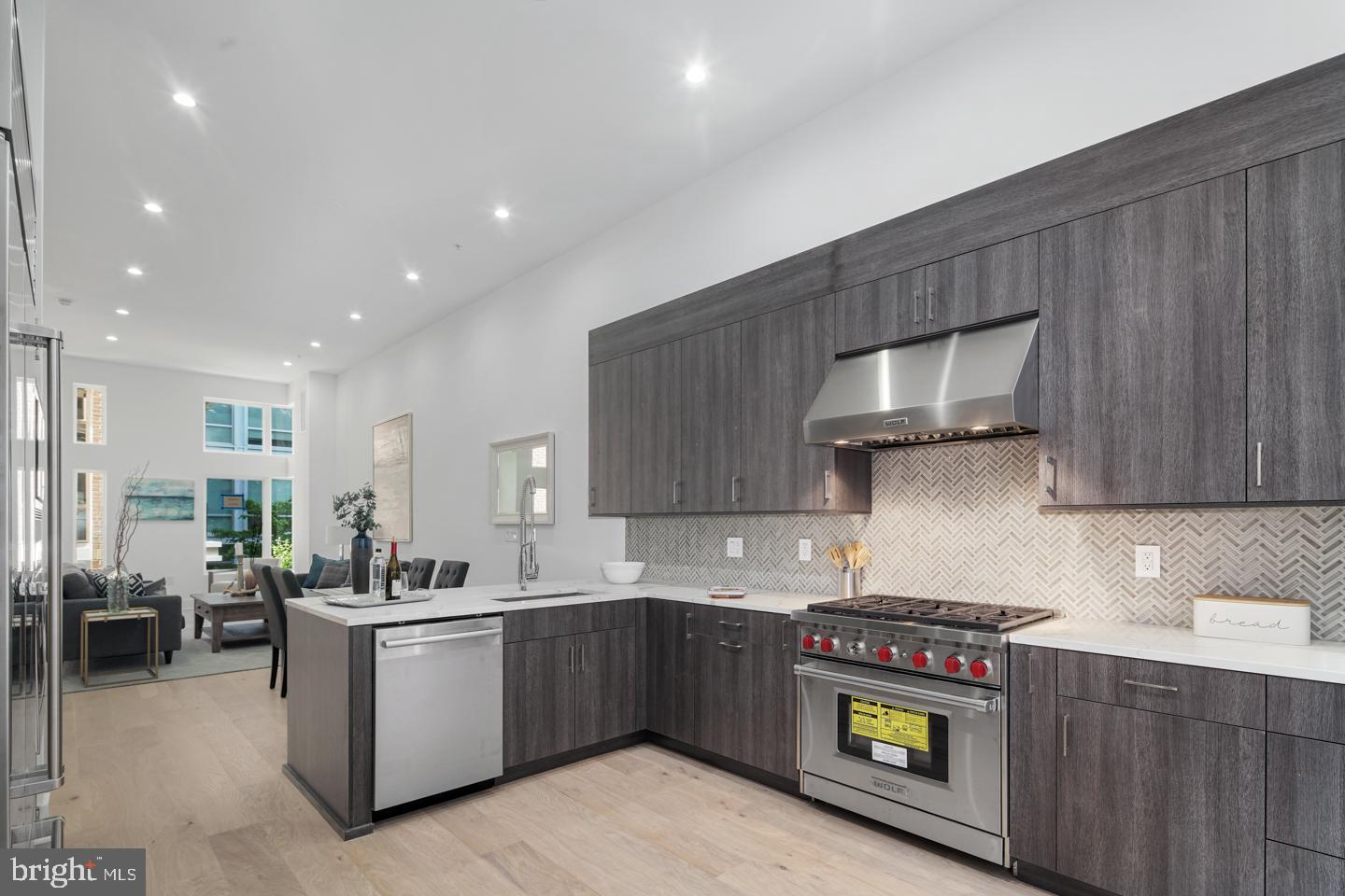 Welcome to Black Horse Alley, a gated community- luxury living in the heart of Old City! This stunning home has +/- 4,000 SqFt of carefully curated living space, 4 bedrooms, 4 full baths, 2 powder baths, a 6-stop elevator, two car garage parking, and two roof decks! The open concept main level is loaded with high-end amenities including a designer kitchen with custom cabinetry and soft close hinges, quartz countertops and a Wolf and Sub-Zero appliance package and outdoor deck. The third level features two generous sized bedrooms with en-suite baths and custom walk-in closets, plus a full size laundry room with Whirlpool washer and dryer. Relax and unwind in your private, fourth floor master suite. Truly an owner's dream with tons of natural light, huge custom walk-in closet and spa-like bath with double vanity, freestanding tub and frameless glass shower with dual shower fixtures. The beautifully finished lower level features a spacious bedroom, full bath, media room - perfect for game days or in-home movie nights! An expansive roof deck offers bonus entertainment space including a pilot house bar with lounge area, sink, and beverage center. Additional standard features include hardwood floors throughout, large format porcelain tile on bathroom floors and showers, multi-zone energy efficient HVAC system, Honeywell alarm system and Control 4 smart home with touch screen and pre-wire package. All square footage numbers are approximate and include above and below grade measurements. Square footage should be verified by the buyer. It is the responsibility of the buyer to verify real estate taxes. Photos are of a similar unit in the development. Abatement ends approx 2029.