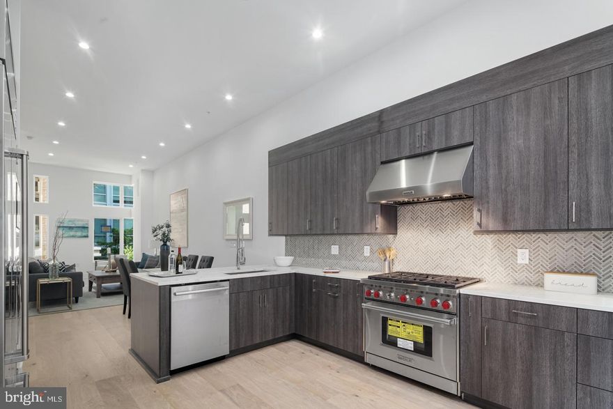 Welcome to Black Horse Alley, a gated community- luxury living in the heart of Old City! This stunning home has +/- 4,000 SqFt of carefully curated living space, 4 bedrooms, 4 full baths, 2 powder baths, a 6-stop elevator, two car garage parking, and two roof decks! The open concept main level is loaded with high-end amenities including a designer kitchen with custom cabinetry and soft close hinges, quartz countertops and a Wolf and Sub-Zero appliance package and outdoor deck. The third level features two generous sized bedrooms with en-suite baths and custom walk-in closets, plus a full size laundry room with Whirlpool washer and dryer. Relax and unwind in your private, fourth floor master suite. Truly an owner's dream with tons of natural light, huge custom walk-in closet and spa-like bath with double vanity, freestanding tub and frameless glass shower with dual shower fixtures. The beautifully finished lower level features a spacious bedroom, full bath, media room - perfect for game days or in-home movie nights! An expansive roof deck offers bonus entertainment space including a pilot house bar with lounge area, sink, and beverage center. Additional standard features include hardwood floors throughout, large format porcelain tile on bathroom floors and showers, multi-zone energy efficient HVAC system, Honeywell alarm system and Control 4 smart home with touch screen and pre-wire package. All square footage numbers are approximate and include above and below grade measurements. Square footage should be verified by the buyer. It is the responsibility of the buyer to verify real estate taxes. Photos are of a similar unit in the development. Abatement ends approx 2029.