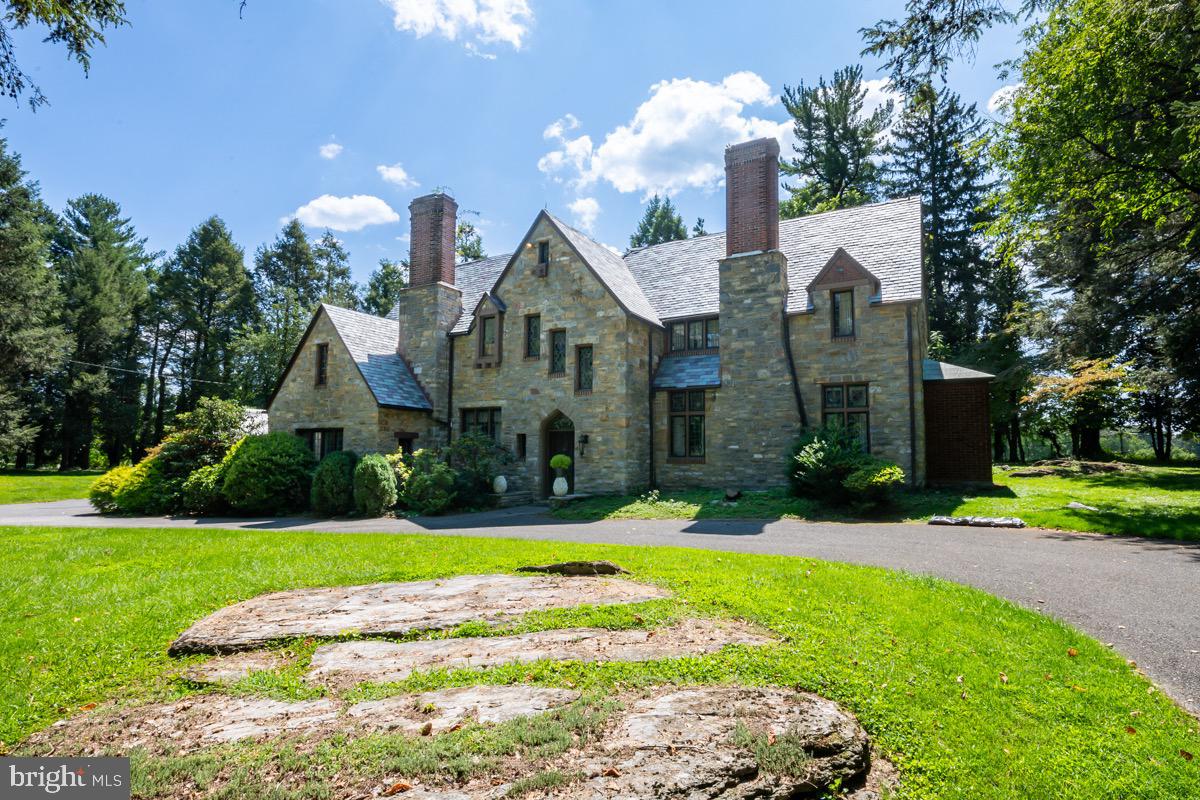 Very attractive 4BR, 2.5 bath all stone Tudor style home on 1.35 acres adjacent to a fairway of the Berkshire Country Club and in Schuylkill Valley Schools . While convenient to the Berkshire it's also approximately one half mile from the Reading Airport and St. Joseph's Hospital. Rt 183 connects with Rt 12, Rt222 and Rt 78. Structurally this fine all stone home is as sound as they come with a new slate roof in 2014 and new carpeting in 2023 accenting its hardwood flooring. The living and dining rooms are as classic as they come with open beam ceiling in the living room with fireplace and bump out bar area and the dining room with its exceptional size. The kitchen does need to be updated at some point to further increase the value of this property and there's ample space to do just that using your imagination in the design. Off the kitchen is a nice stone walled sunken breakfast area which also has access to the dining room. There's a nice patio outback and the yard area is very spacious and private. Upstairs there are 4 bedrooms and 2 full bathrooms. The craftsmanship of this home is undeniable and is evident everywhere one looks. There is a 24 hr showing requirement...please call ShowingTime.
