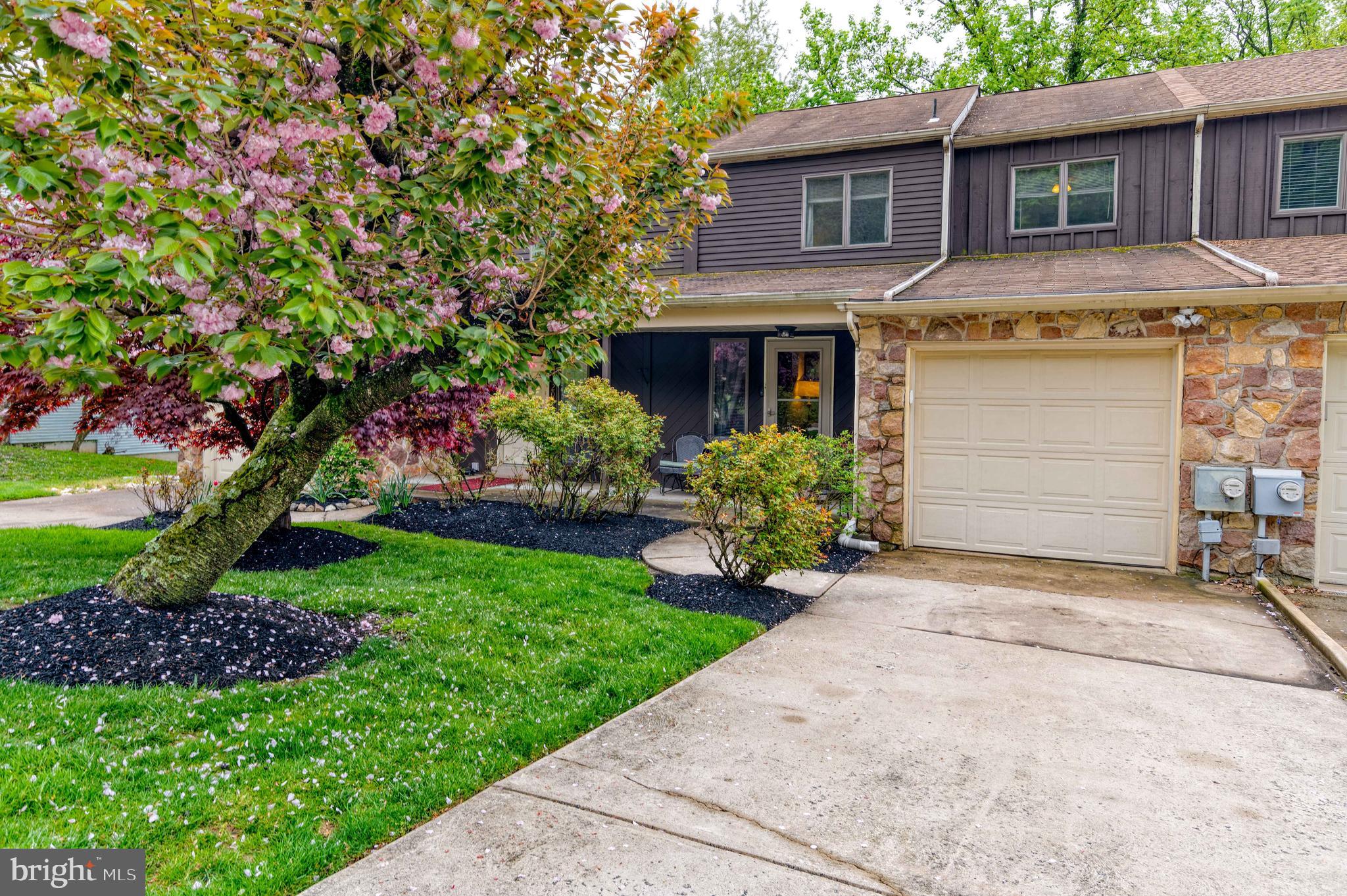 Rarely available and much sought after Stotesbury Townhome in Springfield Township School District  is ready for you to move in!  A cozy covered front porch overlooking a well-manicured lawn welcomes you into this home.  The heart of this well maintained home, the family room— with adjoining kitchen and dining room — make it ideal for gatherings. The first floor also includes a half bath, convenient for entertaining, and a deck overlooking a wooded backyard.  The entertaining space extends to the finished basement.  The large open space with high ceilings is perfect for family game nights, a man cave, or a work from home setup.  The sliding glass doors provide ample light and continued views of the wooded backyard that is perfect for secluded grilling and lounging.  The home’s three bedrooms are located on the second floor.  The owner’s suite has a spacious en suite bathroom with a double vanity and walk in shower.  The additional bedrooms share a hallway bath. The Stotesbury Townhome community is situated on the beautiful grounds of the former Whitemarsh Hall.   Seller will give buyer FIVE THOUSAND DOLLARS ($5,000) towards home upgrades/improvements at settlement. This home is conveniently located near Route 309, the PA turnpike and the Blue Route. Come see this home and imagine how you can make it yours!