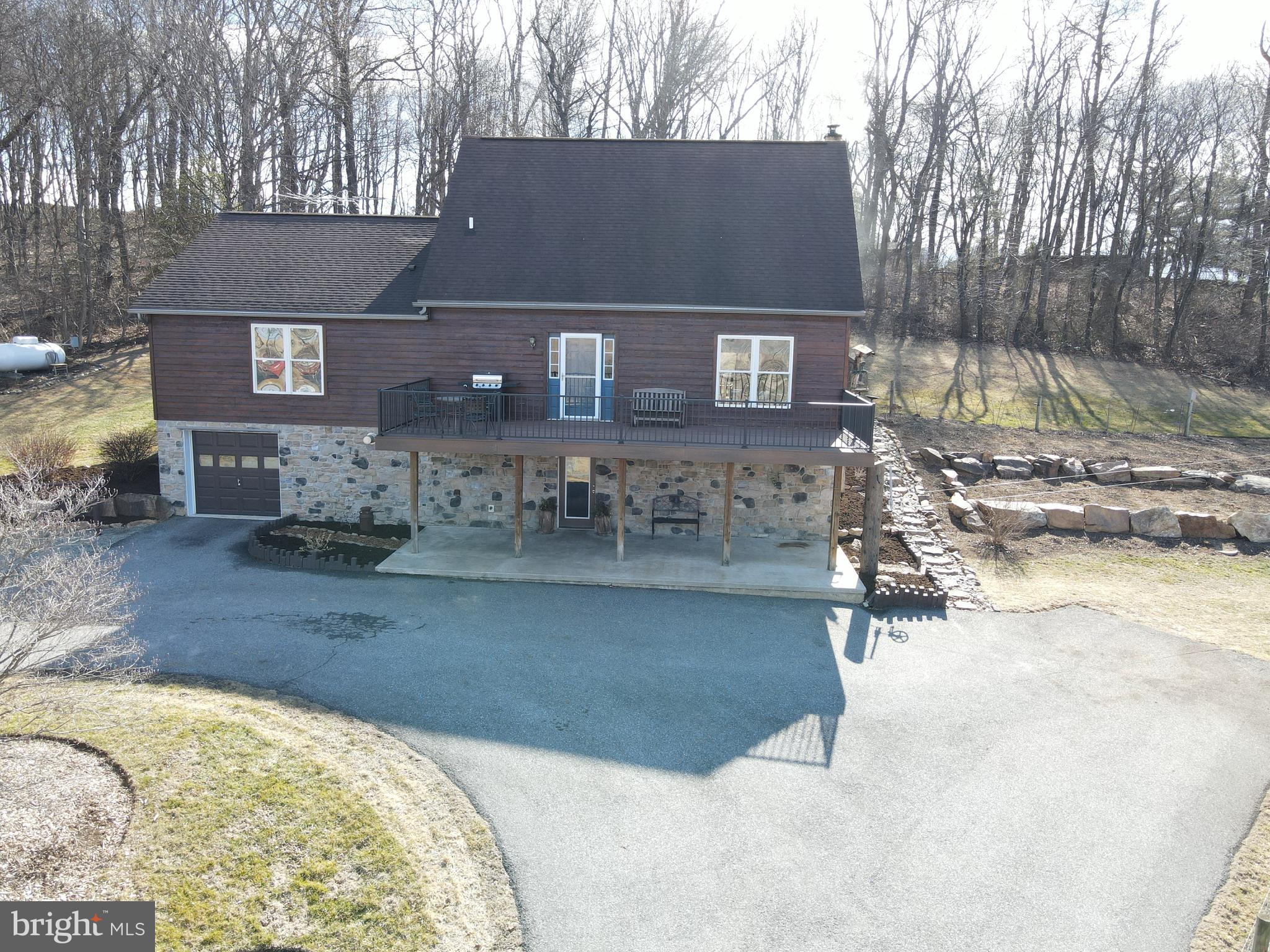 This property will be offered at Public Auction on Tuesday, April 15, 2025 @ 6pm. The listing price is the opening bid only and in no way reflects the final sale price. 10% down due at auction, 2% transfer tax to be paid by the purchaser, real estate taxes prorated. Nestled on 3.8 acres of picturesque countryside, this farmhouse, built in 2003, offers breathtaking views of the surrounding farming community. The first floor features a cozy living room, a spacious eat-in kitchen, a formal dining room with sliding doors that open to a scenic wooded backyard, a powder room, a generous family room, and a master suite with an attached full bathroom. Upstairs, you’ll find two additional bedrooms and another full bathroom. Outside, the property boasts a 24’x40’ detached shop, a 10’x20’ livestock and chicken shed, and a newly built 12’x32’ deck—perfect for enjoying the serene landscape. With a 1-acre fenced pasture and beautiful woodlands, this property is ideal for those seeking a peaceful rural lifestyle.