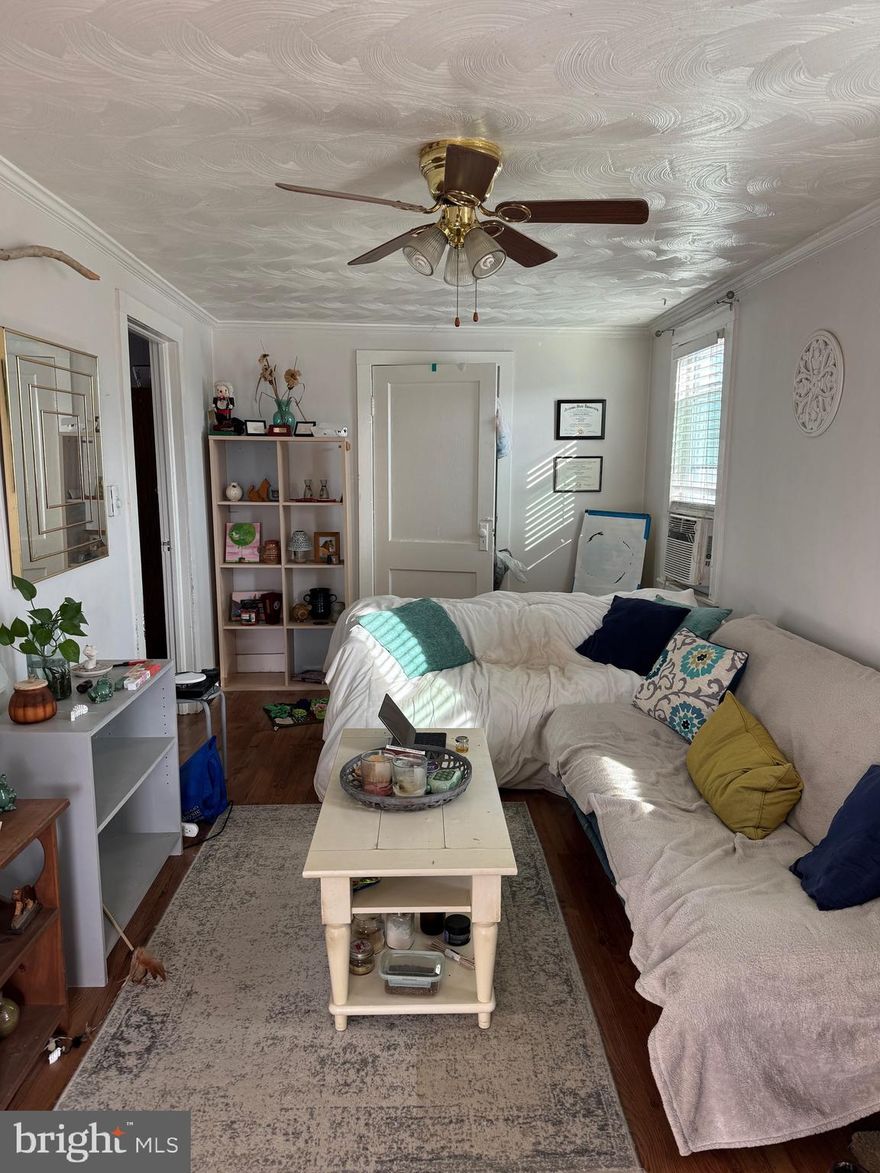 Check out this cozy apartment located in the heart of Charles Town.  This location is very convenient being right down the road from Route 9.  In addition the the 1 bedroom, there is an additional room that is great for recreational space.  There is a small backyard space to enjoy the outdoors and off street driveway parking.  The unit is a second level apartment.  The unit is currently occupied and will be available January 1, 2025.