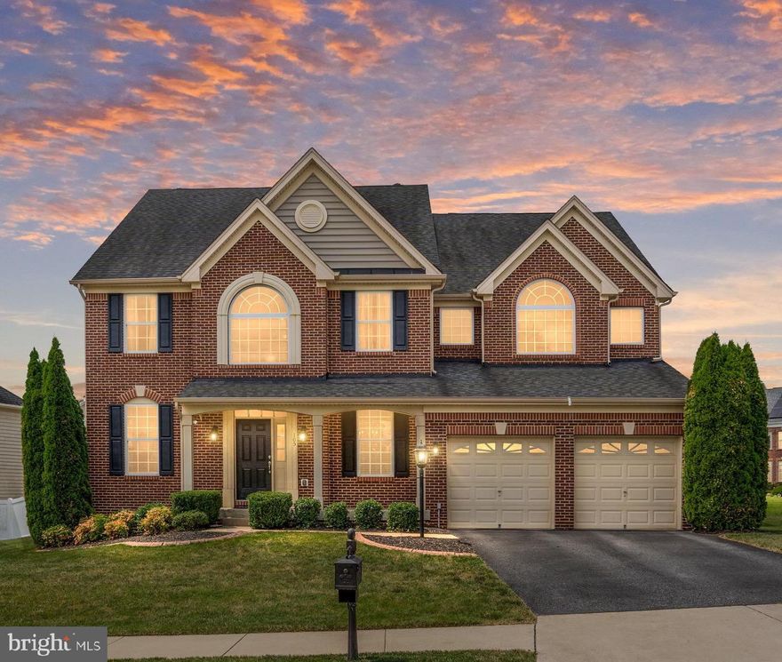 Located in the sought-after Hills of Aquia community, this stunning brick-front 5,400+ square foot home with 4 Bedrooms and 4.5 Bathrooms is beautifully upgraded and offers a perfect blend of modern luxury and everyday comfort. Eye-catching architectural details and thoughtfully designed living spaces are complemented by gleaming hardwood floors, soaring 2-story ceilings, and elegant finishes throughout.  Enjoy multiple lifestyle-enhancing features, including a sunroom, media/theatre room, and new luxury vinyl plank flooring on the lower level. Situated on a premium corner lot with front-facing views of trees, the home boasts meticulously maintained landscaping and undeniable curb appeal. A covered front porch welcomes you into a two-story, foyer that is beautifully flanked by the Living/Sitting Room and Dining Room.  The expansive Family/Great Room is bathed in natural light from its impressive two-story windows and features a striking two-sided stone surround gas fireplace, creating a warm and inviting atmosphere.  The Gourmet Kitchen offers granite countertops, an eat-in island, stainless steel appliances, wall oven, built-in microwave, gas cooktop, and a spacious pantry. Just off the kitchen, enjoy a Breakfast/Sunroom with direct access to the backyard deck. On this level, also benefit from the main-level private office that includes a gas fireplace, providing both function and comfort.  A convenient split staircase leads to the upper level, where you’ll find the generously sized Owner’s Suite with double-door entry, two walk-in closets, and a luxurious en-suite bathroom featuring dual vanities, a soaking tub, a glass-enclosed shower, and a private water closet. The upper level also includes a Second Bedroom with a Private Full Bathroom, and two additional bedrooms connected by a Jack-and-Jill Bathroom—ideal for family or guests.  The Finished Basement, featuring brand new luxury vinyl flooring, significantly expands your living space and offers incredible versatility. Enjoy a spacious Recreation Area with a Wet Bar and Pool Table, a dedicated Media/Theater Room, an Exercise area, a 4th full bathroom, a finished bonus room, and ample storage space. From the basement, you have access to the well-maintained, fenced-in backyard, complete with custom landscaping and a deck that enhances your outdoor living experience.  BONUS UPGRADES include new carpeting, new luxury vinyl flooring, and a 100-amp Generac Generator.  Conveniently located near Route 1, I-95, shopping, restaurants, Quantico, commuter lots, and more—this home offers both luxury and location!