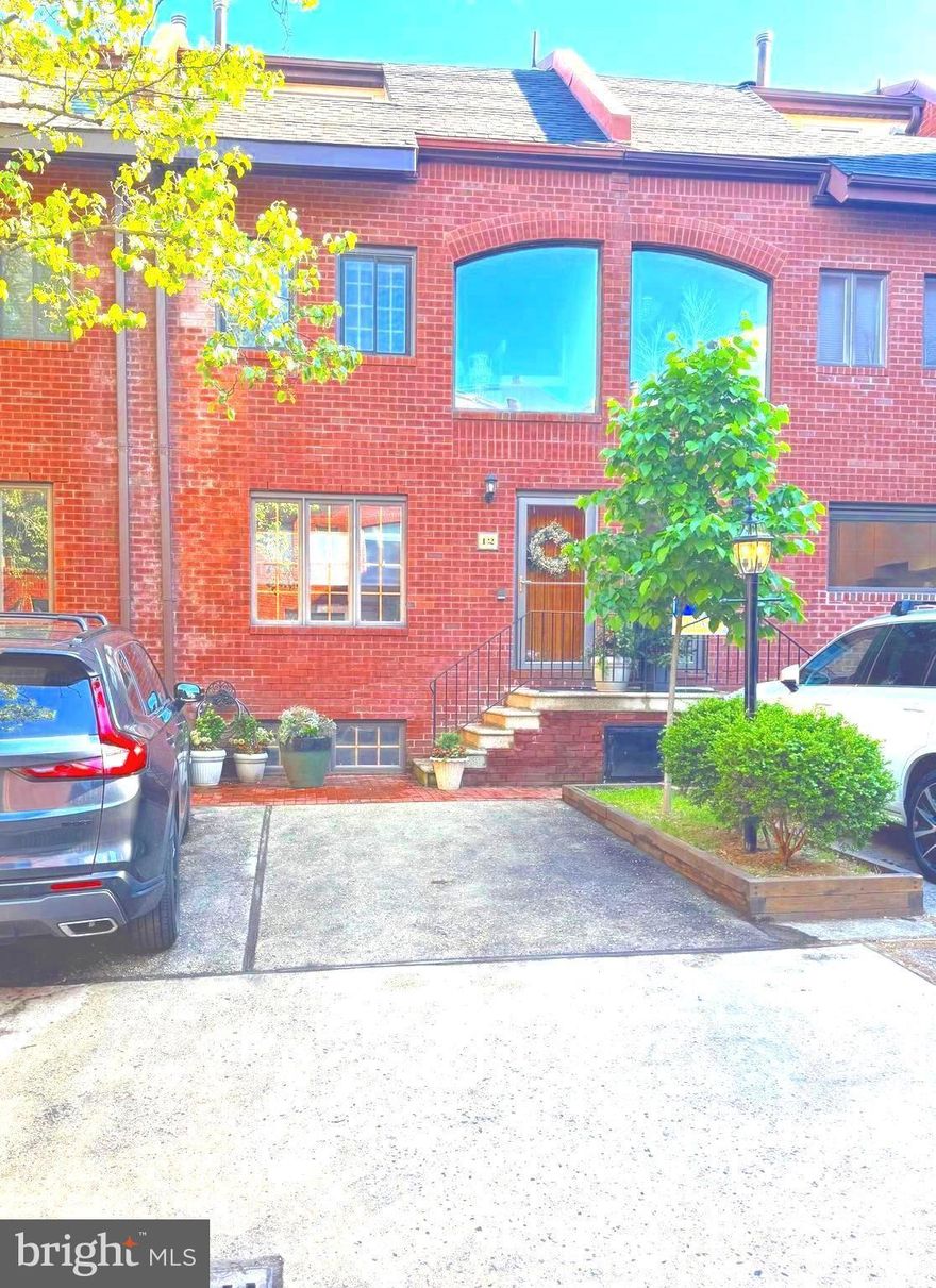 Welcome to elevated city living in the highly desirable and prestigious Queen Village neighborhood.  Enjoy the charm of a quiet residential setting while being just steps from everything you need, markets, shopping, dining and more.
This exceptional home is situated within a rare, gated community, featuring a shared private courtyard and the convenience of your own dedicated parking space directly in front of the property.
You will enter this stunning 3.5 story home into a bright, sun filled eat in kitchen, perfect for everyday living.  Entertain effortlessly in the elegant formal dining room, complete with custom built in cabinets.  Unwind in the sunk-in living room boasting soaring ceilings, recessed and gallery lighting, and a cozy wood burning fireplace.  Step out to the private patio ideal for grilling or enjoying your morning coffee.
Just below the living room you will find a versatile den with a convenient half bath, perfect for a home office, media room, or guest space.  This level also provides access to the full laundry/utility room.
The second floor offers two spacious bedrooms and a full bath with hardwood floors and elevated ceilings.  Ascend to the third floor where a dramatic picture window floods the space with natural light, leading to the primary suite.  this retreat features loft style ceilings, a private balcony for stargazing or enjoying city skyline views and a full en-suite bath.  In addition to central air, the primary bedroom has been upgraded with a dedicated mini-split system for enhanced comfort.  
This beautiful home is a rare find, located within the highly sought-after Merideth School Catchment.