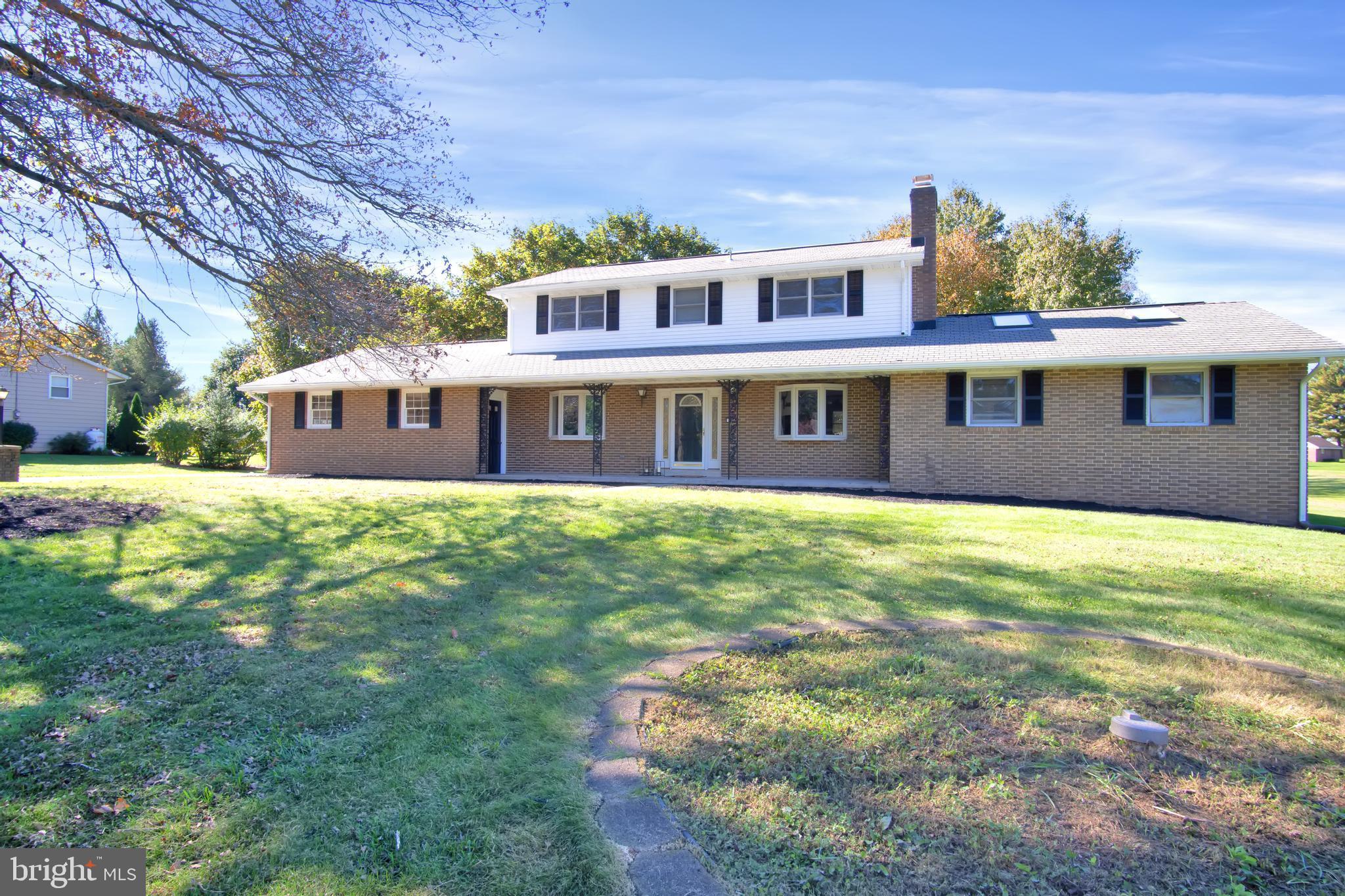 BEAUTIFULLY remodeled 5 bedroom 3 1/2 bath home on over 1 1/2 acres in Mechanicsburg! PRIME location!!! Minutes from D-town Mechanicsburg with all the beauty of a large lot in the countryside.  This home features a first floor owners suite AND first floor laundry so that one floor living is attainable.  A new, gourmet kitchen greats you as you first enter the door, with two tone  colors of white and navy blue.  High end finishes with quartz countertops and gold hardware.  This kitchen was MADE for entertaining and cooking!! Oversized island seats at least 4 people comfortably! The first floor also features a dining area, an at home office space, large all seasons room and cozy living room where you can cozy up to the warmth of a fire in the wood/coal stove on those cold winter nights!
Up the stairs are 4 additional bedrooms and 2 full bathrooms.  One of those bedrooms is another owners suite with an ensuite bathroom!  Perfect for the overnight guest or older kiddo that might need their own space.  The backyard has a paver patio with a serene view of the tree line and grounds.  Want to garden? Want to play a game of ball? Maybe township would permit a pool?? SOOOOOO many options for this property that you can't find for this price in this location!  We are super excited for you to come tour this property, as it is truly a beauty to behold!!