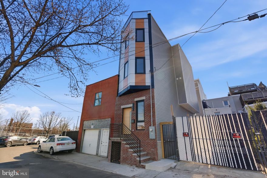 Welcome to 2440 E Harold & 2439 E Huntingdon Street, a brand-new construction homes in the heart of Fishtown with a 10-year tax abatement. 2440 E Harold is 3 bedrooms, 2.5 bathrooms, and nearly 2,000 square feet of finished living space overlooking Aramingo Square. Inside, the home features wide-plank hardwood floors, recessed lighting, high ceilings, and a spacious open living area designed for modern city living. The kitchen is both stylish and functional, offering stainless steel appliances, quartz countertops, a custom tile backsplash, and dual-toned cabinetry. The second floor includes two spacious bedrooms with ample closet space and a well-finished full bathroom. The third floor is dedicated to the primary suite, featuring a spa-like bathroom with double vanity sinks, heated floors, a soaking tub, and contemporary finishes. At the top, a private rooftop deck offers sweeping Philadelphia skyline views, creating the perfect space for entertaining or relaxing. The home also includes a wet bar, adding even more convenience for hosting. The basement provides additional storage space and includes a convenient powder room. Additional features include a dual A/C system, integrated security system with motion sensor, glass-break sensor, and door-open sensors, plus a surveillance system with front and rear cameras. Located just steps from Fishtown restaurants, bars, coffee shops, parks, and neighborhood amenities, 2440 E Harold Street combines the benefits of new construction, smart-home security, and walkable city living in one of Philadelphia’s most sought-after neighborhoods. Schedule your private showing today and experience the best of Fishtown living.