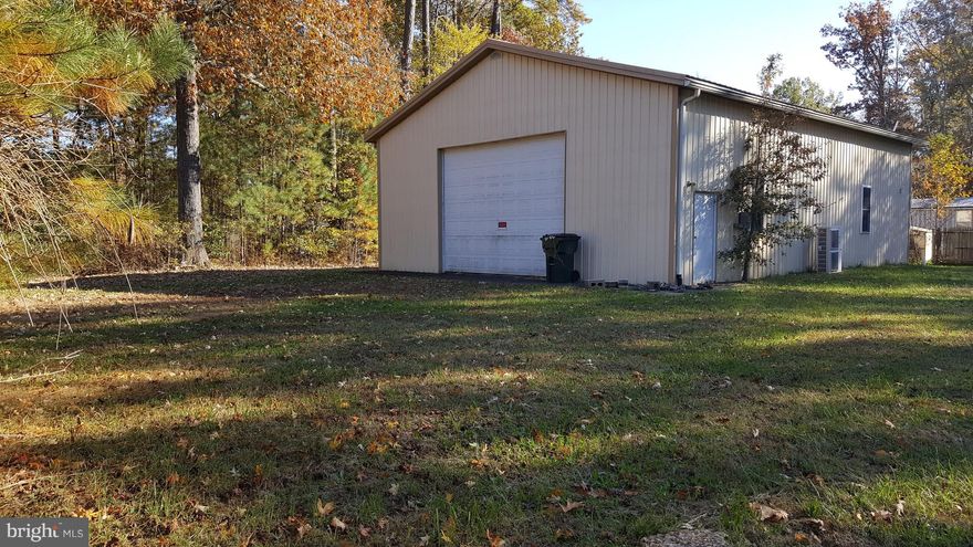 Cleared lot in Westmoreland Shores being sold with WE10379482. Build your dream home on this cleared lot in Westmoreland Shores. Includes 36X50 steel building with  20' ceiling, HVAC, full bath and reinforced concrete slab perfect for the car, boat or RV enthusiast. Voluntary HOA with dock/boat launch. Minutes from the town of Colonial Beach/45 minutes from Fredericksburg.