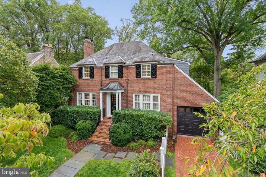 This stunning Colonial Revival home, situated on a spacious quarter-acre lot, combines classic design with modern luxury. Located on a quiet, leafy street in the sought after Spring Valley neighborhood, this property boasts nearly 4,000 square feet of meticulously finished and carefully maintained space as well as a complete main floor renovation by the renowned BOWA design & build company. The home features 5 bedrooms, 4.5 bathrooms, a center hall design with beautiful workmanship, and three floors of living space. As you enter the classic center hall, there is a formal living room with a fireplace and beautifully appointed wet bar and a formal dining room that seats eight to ten. These spaces are designed to allow for uninterrupted flow during entertaining, while hideaway doors create more intimate spaces when desired. Southern exposure ensures that light flows into the hallway through French double doors, which lead to the lush backyard. A beautifully designed eat-in kitchen with an island and ample storage along with a high-ceilinged family room illuminated by large windows emphasize the jewel-box effect. A powder room and a sitting room with William Morris wallpaper complete the main level.
 
On the second floor, the large primary bedroom serves as a private sanctuary with large private windows facing the yard, a sitting area, walk-in closet, and marble bathroom featuring two sinks, separate shower, and a clawfoot tub. Three additional bedrooms and two full bathrooms provide ample space for family or guests. The second floor opens onto a private sun deck, a perfect place for stargazing and enjoying tremendous views of old growth trees and sunsets. The second floor provides access to a large, insulated attic, providing generous additional storage.
 
The spacious lower level includes a bedroom with private entry, full bath, recreation room, exercise room, laundry area, and an office area with built-in bookshelves and cabinets. Plentiful windows again ensure that light fills the space. Its open floor plan enhances the home's functionality and maximizes available living space.
 
The backyard is complete with a raised patio, which leads to a large lower terrace and a carefully maintained, professionally landscaped backyard with mature plantings. There is a one-car garage, two additional off-street parking spaces, and plentiful street parking.
 
The home is within walking distance to hot spots such as Millie’s, Bluestone Café, Pizzeria Paradiso, and Compass Coffee. Other local amenities include CVS Pharmacy, Wagshal’s Market, a gas station, and much more.
 
This Colonial Revival masterpiece is a model of thoughtful design, offering the perfect combination of space, style, and location in one of Washington D.C.'s most desirable neighborhoods.