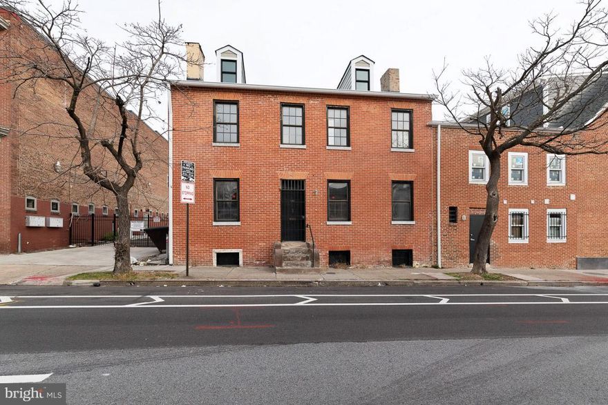 Price reduction! This charming home in the sought-after Seton Hill Historic District is an absolute gem!  So unique, and fully restored.  Hardwood floors throughout (living room and second floor bedrooms have carpet, with restored hardwood beneath).  New kitchen and baths.  Roof and systems replaced in 2017, exterior lead paint professionally removed and brick restored and repointed in 2016.  Built-ins throughout (seller collects vinyl records).  Attention to detail is astounding!  First floor features living room and dining room, each with a decorative fireplace, new kitchen with solid wood cabinets and wood countertops.  First floor full bath is brand new.  Second floor with two bedrooms and a new bath featuring a beautiful soaking tub.  The third floor has two rooms that are finished, with low ceilings.  Could be used as bedrooms, office, storage - you decide.  Basement with exterior entrance, new laundry room, clean and dry.  There is a rear courtyard with privacy wall that is perfect for entertaining.  Location is fantastic - just a short walk to the University of Maryland Baltimore campus and the University of Baltimore, easy walk to the restaurants and activity of Mount Vernon, close to the train station.  Across the street from beautiful St. Mary's Park.  Zoning allows for  residential or commercial use.  Charming, one of a kind in beautiful Seton Hill!