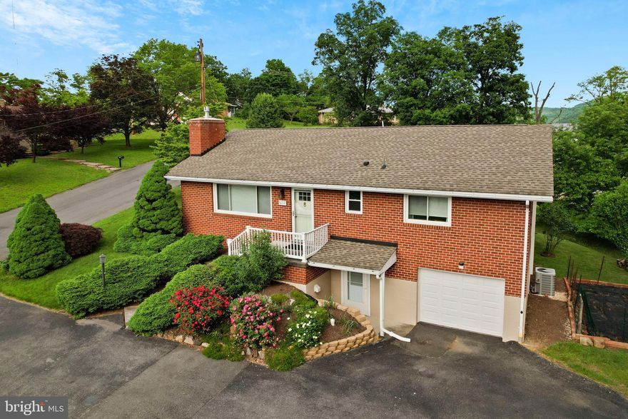 Welcome to this stunning ranch-style home nestled on a .42-acre corner lot, offering breathtaking mountain views from every room. This beautifully maintained residence features 4 spacious bedrooms and 2 full bathrooms, making it ideal for families of all sizes.

As you step inside, you'll be greeted by new flooring and a cozy fireplace in the family room, perfect for relaxing evenings. The home boasts two fully equipped kitchens, including a finished recreational room with its own kitchen, providing ample space for entertaining guests or extended family living.

Enjoy the convenience of central air, a new hot water heater, and recent updates such as a new roof, new garage door, and new exterior doors. The living room and bedrooms have been enhanced with new windows, ensuring plenty of natural light and picturesque views.

Outside, you'll find a charming side porch, a spacious deck, and a large driveway leading to a well-maintained garage. The property also includes a shed with a new roof, offering plenty of storage for your outdoor needs. The beautifully landscaped yard is perfect for gardening, playing, or simply unwinding while taking in the serene mountain scenery.

This home has been thoughtfully updated from 2016 to the present, including replacements of both fireplaces, a repaired chimney cap, and a new A/C and air handler. All appliances convey, making your move-in seamless and hassle-free.

Don't miss out on the opportunity to own this amazing home with spectacular mountain views and modern comforts. Schedule a showing today and experience the beauty and tranquility this property has to offer!
Close proximity to UPMC,  Allegany College, Shopping,  Restaurants and Downtown Cumberland.