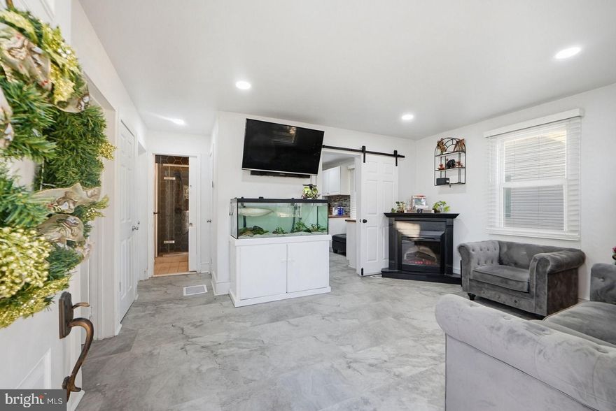 Welcome to 310 Townsend Avenue, a refreshed Cape Cod-style single-family home with 3 bedrooms and 1 bath, tucked into a quiet neighborhood in Anne Arundel County. This home offers flexibility, space, and features that make everyday living easy.

Eligible first-time homebuyers may qualify for up to $20,000 in income-based down payment assistance through a lender program. Buyer to verify qualifications.

The multi-level layout gives you options. The main level includes a separate room that works well as a pet space, yoga room, or indoor garden. Upstairs, the full bedroom includes a built-in recording booth, a great setup for music, podcasting, or content creation. The unfinished basement adds storage now, with room for future use.

Outside, the fully fenced yard is split into two sections, perfect for pets and everyday use. A walkout deck and gazebo create a comfortable outdoor space, while the above-ground pool adds summer fun and can be relocated if desired. A shed provides extra storage.

Parking is simple with space for three to four cars in the driveway plus street parking. No HOA. County services include trash pickup and road plowing, keeping monthly expenses straightforward.

A solid home with useful updates, flexible living areas, and room to make it your own.