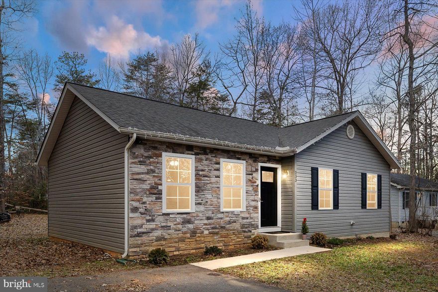 Buyers lost financing -- their loss is your gain! Welcome to endless possibilities!  Allow this gem to be an amazing starter or the perfect downsize to one-level living.  Nestled in serenity, this lovely rambler is housed in a gated community with lake access on 1/2 level acre.  Community amenities include beach access, clubhouse, dog park, fitness center, community docks and more! Under 10 minute from I95, this barely used, "nused" construction boasts hardwood flooring, inviting kitchen with stainless steel appliances,  granite countertops, and plenty of cabinet space.  Property offers 3 sizable bedrooms and 2 full baths.  Owners suite offers ensuite bath and sunny, well-sized living quarters.  Secondary bedrooms are also spacious.  Both baths have updated vanities and fixtures.  Vaulted ceilings upon entry offer neutral paint with carpet and hard wood mix.   Home is well-maintained.  The community pool is an added perk to this wonderful find.  Not far from commuter/carpool lots, this property is also eligible for 100% USDA financing.  Seller has found home of choice and is ready for your winning offer.   Run, don't walk -- this one won't last!  PLEASE ADVISE BUYERS OF$1,500 HOA TRANSFER FEE/RE-KEY FEE PAYABLE AT CLOSING.