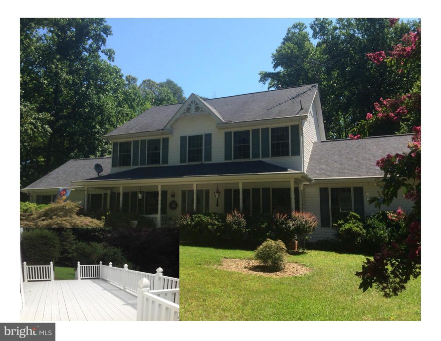 Spacious victorian to include a main level mstr suite (in-law) and 2nd level mstr, formal living room, family room, 2 kitchens, full length maint. free decking across rear of home,. Over-sized front porch, New Carpet (Neutral).  Priced to sell! Situated on a lot that offers loads of privacy &  luxury custom. Gorgeous setting!