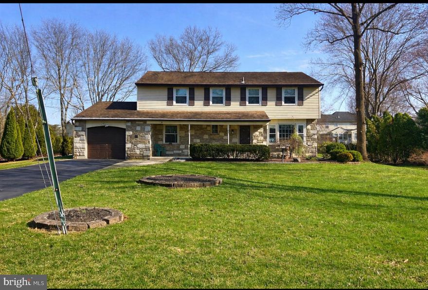 Welcome to this beautiful colonial located in the highly sought-after Orchard Hill neighborhood in Churchville. This spacious four-bedroom, 2.5-bath single-family home offers a perfect blend of charm, comfort, and functionality. Owned by the same family for 40 years, this home has been meticulously maintained, reflecting true pride of ownership. Step inside to find hardwood flooring throughout, with some areas currently covered by carpeting. The inviting family room features a cozy wood-burning fireplace, while the formal living room is filled with natural light from a large front window and offers serene backyard views, complemented by elegant custom built-ins. A formal dining room with classic chair rail detailing provides the perfect space for entertaining. The updated kitchen boasts white cabinetry, black granite countertops, and stainless steel appliances. It flows seamlessly into an oversized laundry room, which provides convenient access to both the backyard and the attached garage. A convenient half bathroom is also located on the first floor. Upstairs, you’ll find four generously sized bedrooms, including a spacious primary suite complete with a private en suite bathroom. An additional full bathroom serves the remaining bedrooms. The partially finished basement offers incredible versatility, with approximately three-quarters of the space already completed—ideal for a family room, playroom, home office, or man cave. Additional upgrades include a brand new HVAC system, updated windows throughout, and a brand new Generac generator, providing energy efficiency, peace of mind, and reliable power backup. Located within the award-winning Council Rock School District, this home truly has it all—charm, space, and a prime location. Beautifully maintained inside and out, it’s ready for the next family to enjoy for many more years.