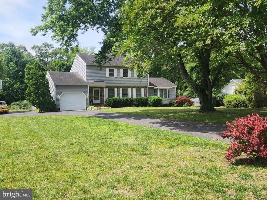 This property is the perfect blend of rural living with the convenience of town just minutes away. The location couldn't be better, just minutes to the Salisbury Regional Airport, Salisbury University, Tidal Health, and 30 minutes to Ocean City Beaches — an incredible value you don’t want to miss. Driving up to the home you will notice the a wide driveway that leads to the meticulous landscaped yard, wide parking area for  playing basketball or additional parking. As you enter, you will find that this two-story home offers the primary bedroom with its own private bathroom on the 1st floor. On the same level you will find a very large living room with a cozy fireplace. Next to it is the separate dining room with sliding glass door that leads you to the enclosed rear porch and from the porch you can head out to the spacious deck and yard, which is ideal for outdoor entertaining and overlooks mature trees. A half bath and laundry room completes the main level tour. Ascend to the 2nd level and you will find 3 very bright and spacious bedrooms with lots of closet space. This home is nestled on nearly one acre and can be your lovely home full of peace and tranquility.