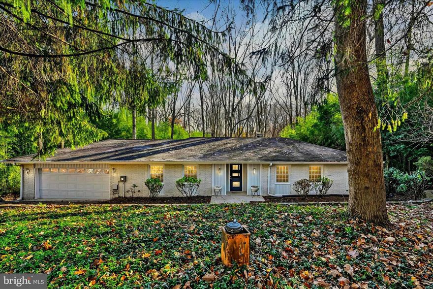 WELCOME TO YOUR PRIVATE OASIS IN THE WOODS
Nestled at the end of a quiet, private court, this stunning home offers the perfect blend of tranquility and convenience. Surrounded by lush trees, you’ll feel like you’re miles away from the hustle and bustle, yet you’re just moments from major roads and shopping.
ENTER AND BE WELCOMED
As you pull into the spacious 2-car garage, you’ll appreciate the convenience of direct access to the kitchen, making unloading groceries a breeze. For guests, the main entry leads into a beautiful foyer, a central hub that connects the entire main floor.
Straight ahead, the sunken living room is the perfect place to unwind, featuring a cozy fireplace and sliding doors that open to the deck—ideal for indoor-outdoor living. The living room flows seamlessly into the open dining area and an updated kitchen designed for the home chef. With ample counter space, stainless steel appliances, and a large, deep sink, this kitchen is as functional as it is stylish.
PERFECT FOR ENTERTAINING
Adjacent to the kitchen is a spacious family room, providing the perfect space to gather. The open layout throughout this level creates an effortless flow for entertaining guests, whether you're hosting a dinner party or a casual get-together.
PRIVATE RETREAT
For privacy, the sleeping quarters are tucked away down a quiet hall. The generous Primary Bedroom features an ensuite bath and double doors that open onto the deck, offering a peaceful view of your wooded lot. Two additional bedrooms share a full bath on this level, providing ample space for family or guests.
EXPANSIVE LOWER LEVEL
The lower level offers even more living space, including a second family room and an additional room that could easily serve as a fourth bedroom, complete with its own ensuite bath. Whether you need a guest suite, office, or extra living area, this space offers flexibility to suit your needs.
Storage is never a problem here, with a huge storage room and a large laundry room providing plenty of space to keep your home organized and clutter-free.  Here, you will also find the brand new HVAC system that was just installed coverting the system from oil to an electric Heat Pump
YOUR NATURE-FILLED ESCAPE
Step outside to the deck and lower patio, where you’ll enjoy views of the tree-lined lot that offers ultimate privacy and a serene setting. Surrounded by nature, this is truly your own private retreat.
If you’ve been looking for a home that combines comfort, style, and seclusion, this is the one. Come see your nature-filled private oasis—where the best of both worlds meets.