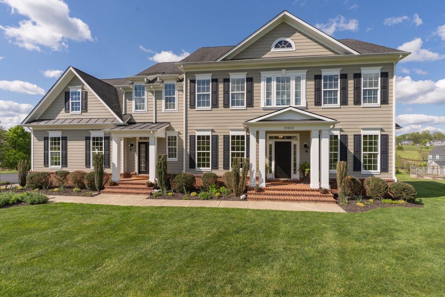 Set on 3.54 private acres in the heart of Western Loudoun County, this exceptional Carrington-built Colonial home delivers a refined balance of luxury, craftsmanship, and everyday livability. Constructed in 2016, the residence reflects thoughtful design, timeless finishes, and meticulous care throughout.

The home, with 6,039 finished square feet, offers five spacious bedrooms and four and a half baths, anchored by a well-appointed gourmet kitchen designed to impress. Featuring an expansive center island, built-in appliances, and generous pantry space, the kitchen opens seamlessly to the breakfast area and inviting family room—creating an ideal environment for both daily living and sophisticated entertaining. 
Hardwood flooring extends throughout the main living areas, complemented by plush carpeting in the family room. Architectural details such as crown molding, chair rail, and recessed lighting add depth and elegance to the interior. The home’s interior is complemented by the panoramic sightlines through every window, including seasonal views of the Catoctin Creek. 

The primary suite is designed as a true retreat, offering a spa-inspired bath with soaking tub, walk-in shower with dual shower heads, and spacious walk-in closets with custom cabinetry. Each additional bedroom is well-proportioned with one bedroom as an ensuite and two additional bedrooms sharing a bathroom. The upper level is serviced by two staircases, one from the foyer and the other from the mudroom.

Outdoors, the property continues to impress. An expansive Trex deck and patio overlook a peaceful open vista, ensuring both privacy and a connection to nature. The covered outdoor pavilion with wood-burning fireplace is an enjoyable space to relax and enjoy the views. The three-car side-entry garage and extended driveway provide ample parking and convenience.

Additional highlights include an expansive lower level with a fifth bedroom and full bathroom and walkout to a stamped concrete patio. The expansive recreation room mimics the floor plan from above. Additional storage can be found in the lower level.

Located Old Wheatland Estates, an established community, the quarterly HOA fee is low and covers basic amenities services such as refuse and recycling. This is a residence that speaks to those who value space, privacy, and quality construction—offering a rare opportunity to secure a distinguished home in one of Loudoun County’s most picturesque settings.