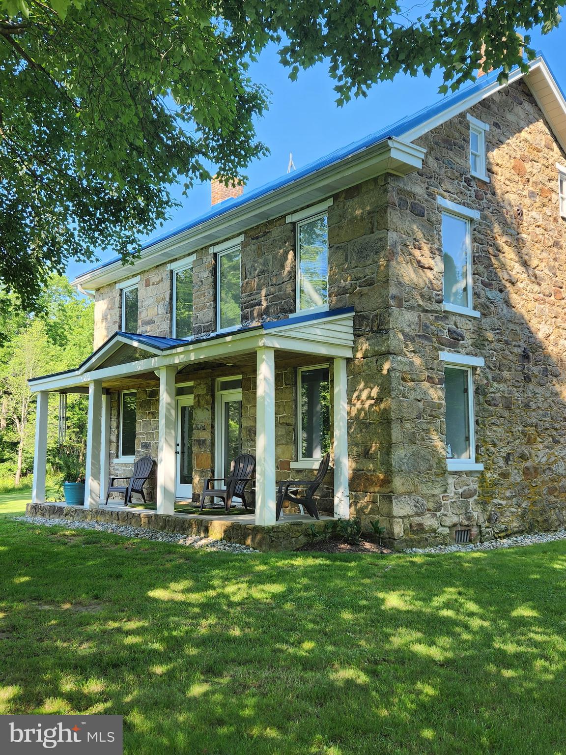Situated on just over Twenty Six acres, this updated stone home blends classic charm with modern amenities. The spacious home features Four bedrooms and Three baths, including a main-floor primary suite for ultimate convenience. A custom kitchen with high-end finishes flows into a stunning atrium, creating a bright and inviting atmosphere. Beyond the home, the property boasts a Forty eight hundred sq. ft. shop, with over Eighteen hundred sq. ft. of fully finished space, perfect for business, hobbies, or storage. A 20x24 tractor shed adds even more versatility. With mixed-use zoning, this property offers endless possibilities, whether for residential, commercial, or agricultural use. Enjoy the beauty of country living with the space and flexibility to make it your own!
