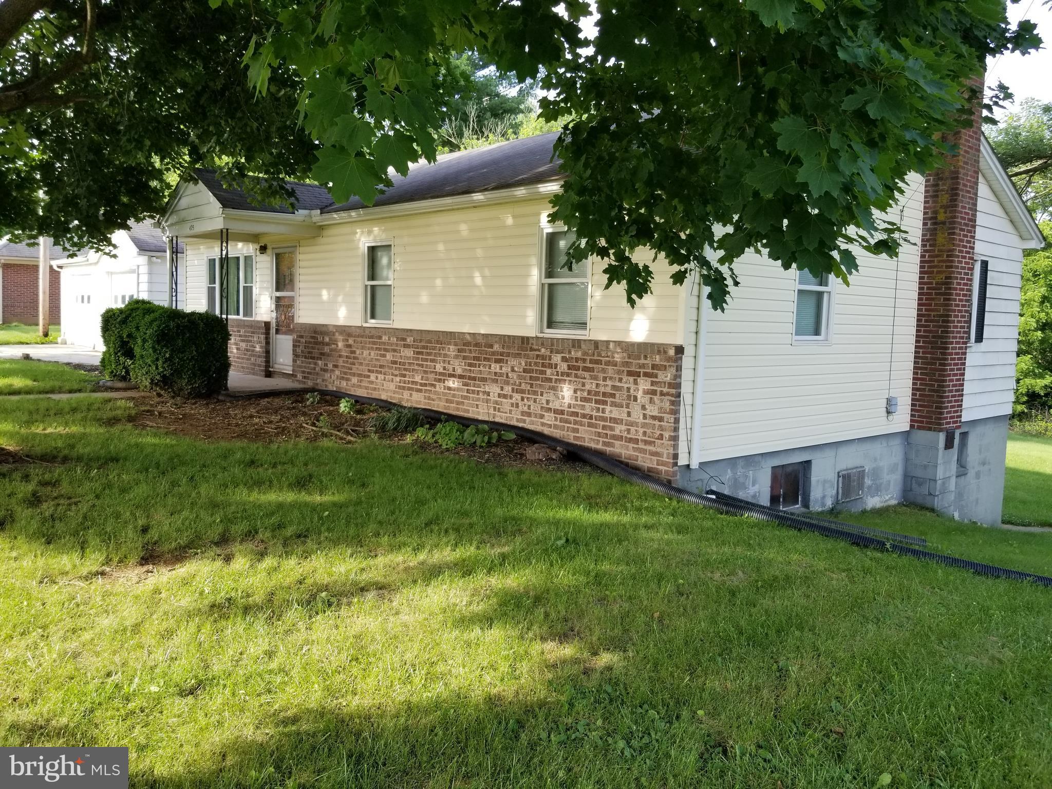****Rancher**** Cute kitchen w/ A lot of cabinet space *** Newer Bathroom*** 3 Spacious Bedrooms, Big living room, Beautiful Back yard backing up to trees, Walk out basement, Bathroom in Basement with Shower Rough in, Large Basement waiting for your finishing touches, Breezeway going to the 2 car garage, offering lots of room for storage. This Home has a lot to offer for a low price. Sold As Is