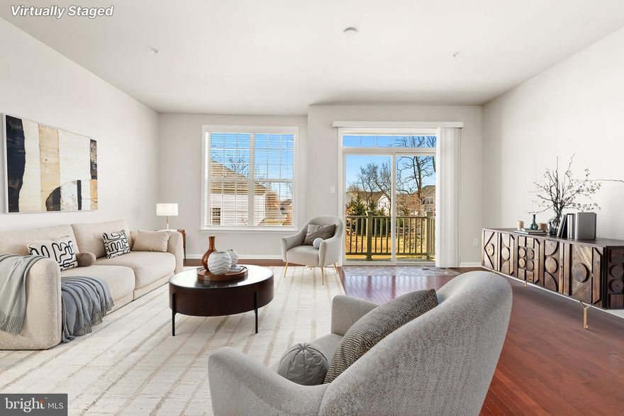 Welcome to this stunning 3-bedroom, 3.5-bath townhome, built in 2018 by renowned builder DR Horton. Thoughtfully designed for modern living, this freshly painted home offers stylish finishes, flexible spaces, and unbeatable convenience. The ground floor opens to a versatile living area with recessed lights and a full bath for added flexibility. Access the rear-entry two-car garage directly from this level, offering secure parking and additional storage. The heart of the home is a bright, open-concept space perfect for both daily living and entertaining. Rich hardwood floors flow throughout the living, dining, and kitchen areas, creating warmth and continuity. The chef’s kitchen is a true standout, featuring granite countertops,  elegant Tahoe Maple Espresso cabinets, and a large island. The living area opens to a rear balcony, perfect for morning coffee. A convenient half bath completes this level. Retreat to the spacious primary suite with a private en-suite bath and a generous walk-in closet. Two additional bedrooms, a well-appointed hall bath, and a laundry area offer convenience and comfort for everyone. Brand-new carpeting on the stairs and throughout the upper bedroom level adds a fresh, cozy touch. This vibrant community offers resort-style amenities designed for recreation and relaxation. Residents enjoy key-fob access control to the clubhouse, a fully equipped fitness gym, and a sparkling community pool—perfect for warm summer days. Outdoor enthusiasts can take advantage of the basketball and tennis courts, with a brand-new pickleball court coming soon, adding even more opportunities for fun and fitness. Ideally situated just off I-495, this home offers easy access to major routes and is only 2.5 miles from the Largo Metro, which makes commuting effortless. It is also conveniently located directly across from Woodmore Shopping Centre, providing endless shopping options, dining, and entertainment.