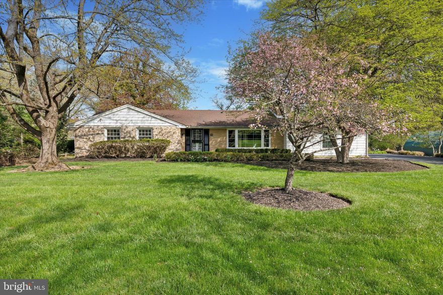 Tucked away on a quiet, tree-lined street, 4117 Hain Drive offers the perfect blend of privacy, charm, and modern comfort. Step inside to a warm and welcoming living room featuring an original brick wood-burning fireplace with built-in shelving and floating stone hearth. Original parquet floors lead you into the dining area and adjacent kitchen, which offers granite countertops, stainless steel appliances, a five-burner range, double wall ovens, and a convenient pantry.
The family room boasts vaulted ceilings, floor-to-ceiling windows, and skylights that bathe the room in natural light. A stone gas fireplace and a built-in wet bar with its own ice machine enhance the room’s comfort and versatility. Brand-new sliding glass doors open to a newly finished wood deck that overlooks a generously sized, flat backyard. You'll also appreciate the new siding, giving the exterior a refreshed and polished look.
The first-floor primary suite is thoughtfully placed on the opposite end of the home, featuring large windows with serene backyard views and an en suite bathroom. Two additional guest bedrooms and a full hall bath complete the main level.
Downstairs, the finished lower level offers a flexible bonus space ideal for a second entertaining area, guest suite, or home office. This area includes its own full bathroom and a walk-in cedar closet. The lower level also houses the laundry area and provides ample storage.
Additional highlights include an attached two-car garage and a prime location in the heart of Lafayette Hill—just minutes from parks, shopping, dining, and top-rated schools. Don’t miss your opportunity to own this one-of-a-kind property that truly feels like home.
