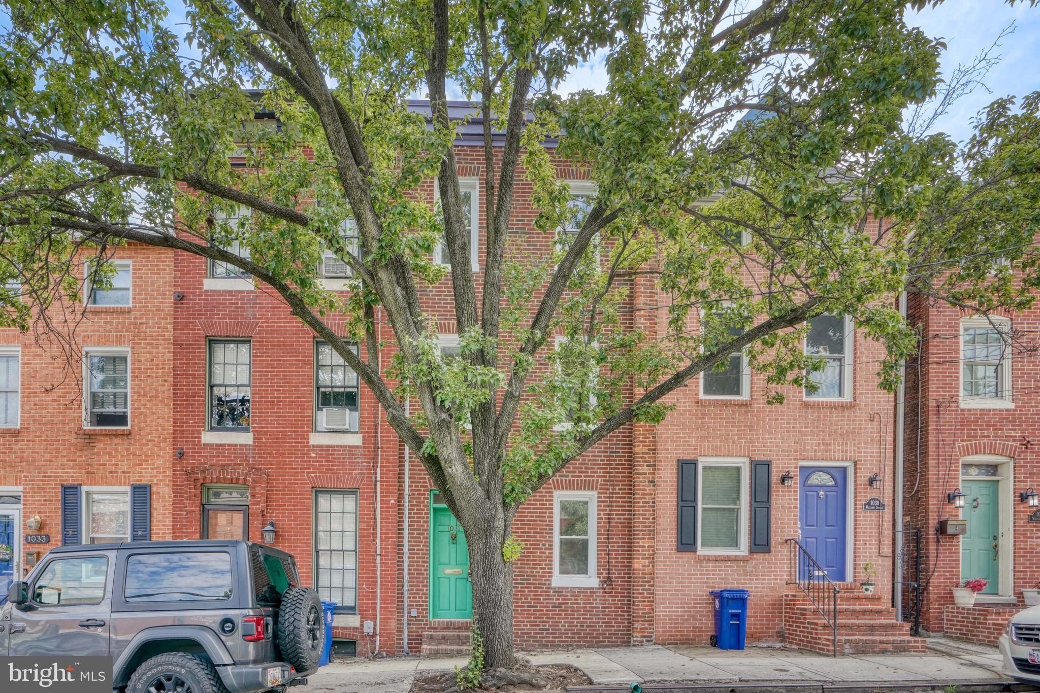 Spacious 3 story, 3 bed, 2 full bath Federal Hill Row home in an ideal location! There are TWO ample sized living room areas with wood burning fireplaces and built in shelving on the first and second floors. The recently renovated kitchen and dining room combination is full of light streaming in from the glass sliders that grant access to a private backyard. At the rear of the second level is the first bedroom with an en-suite bath. Two more ample sized bedrooms, as well as a second full hallway bath, make up the 3rd level of the home, brightened by the hallway skylight. Central AC is located on the third level keeping it cool throughout. Inspections were completed and many features updated within the last year: overhead and recessed lighting added; kitchen, closets, fireplace, and bath updated; fresh paint added.