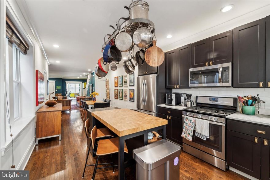CONTACT DAVID FELDMAN FOR AVAILABLE MORTGAGE 1% BELOW MARKET RATE, FOR MONTHLY PAYMENT EQUIVALENT TO PAYING $65,000 BELOW ASKING PRICE.

High tech meets classic University City architectural charm! This classic 1920s home has a traditional front sun porch, beautiful wood flooring, architectural moldings, gracious proportions, and a GARAGE AND PARKING SPACE off the wide rear driveway. In 2015 it was renovated from top to bottom for the owner, adapting the home to 21st century lifestyles without losing any of the original character.  This home is located in the Lea Elementary School catchment, a school that Penn has undertaken to support through a multi-year, multi-million dollar partnership.

The large, former 4 bed/1 bath home now is laid out with 3 large bedrooms and 2.5 modern bathrooms. The front two bedrooms were combined to provide an elegant primary bedroom suite rivaling resort hotel suites, with a large walk-in closet/dressing room and a spacious skylit bathroom with floating double sink vanity, large frameless shower and separate WC enclosure, and a south facing sun-kissed deck off the bedroom. Note the beautiful and unique narrow width oak strip flooring on this level.

The main floor has been opened up, skillfully providing defined living, dining and kitchen areas, as well as maintaining the south facing sun room, while giving clear views from the front of the house to the rear, flooding the space with light. The original, multi-paned front door opens to an entry area, providing a space to remove shoes and coats before entering the main sitting area or the versatile front sun room, which is perfect for a quiet reading or work space. The central dining space allows for intimate seating or expanding a table for large holiday dinners. The kitchen provides expansive counter space and storage, and the current owners will be leaving the island and hanging pot rack installed to complement that space 

The basement is semi-finished with cleanly sealed walls and floors and is watertight. There is direct access to the large garage, which has room for your car and bicycles. The new energy efficient electric washer and dryer will remain for you, as will the very useful storage shelving.

The real excitement of the basement is that it is the tech center for the extensive and high cost improvements that the current owners have installed, bringing this home to the highest level of today’s technology for sustainability, resiliency, and better living—be prepared to completely geek out! The home has 21 solar panels, with both two-way metering and a storage battery, that dramatically reduces electric bills--It also provides independence and resiliency, with the ability to bridge times without electricity, keeping your lights on during and after a storm, or charging to and from an electric vehicle. But the tech doesn’t stop there! The home has a water filtration and purification system, connected to the flexible whole house water manifold system. The main panel for the whole house cat 5e (internet) and coax (tv) cabling are also located here-boast of having the best and most reliable internet connectivity in the neighborhood! See the detailed description of these systems provided by the owner. In addition to these most recent high tech upgrades, all the basic home systems, including electrical, plumbing, heating and cooling, and main roof, were all replaced as part of the 2015 total renovation.

This is a truly incomparable home-charm with total renovation, and unmatched technology for better living and sustainability, walkable, transit oriented, with parking for two cars, and ease of bike storage and access--no living room bike racks needed!  Truly a home without equal in University City.