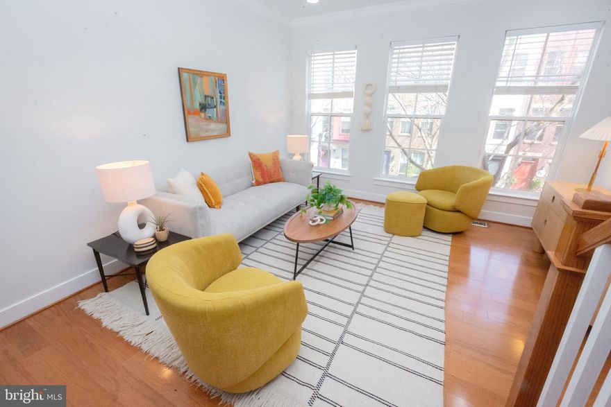 Dialed-in, thoughtfully updated, and filled with natural light, this Arts District Hyattsville home delivers a level of finish and functionality that immediately sets it apart. Fresh interior paint, new flooring on both the entry and upper levels, and rich hardwoods throughout the main living areas and staircases create a cohesive, move-in-ready feel from the moment you step inside. Storage is abundant, closets are generous, and garage parking adds everyday ease that’s increasingly hard to come by.

The kitchen is a true standout—not just in features, but in execution. Stainless steel appliances, granite countertops, and cherry cabinetry are complemented by a crisp white subway tile backsplash extended all the way to the ceiling, creating a cleaner, more elevated look that goes beyond the typical builder finish.

The main living level strikes the right balance between openness and definition, offering spaces that feel connected without sacrificing function—equally suited for daily living or hosting.

Upstairs, two comfortably sized bedrooms share a well-appointed full bath with double vanity and soaking tub. The top-level primary suite serves as a private retreat, complete with direct access to the rooftop terrace—one of the home’s most compelling lifestyle features. The ensuite bath includes dual vanities and a spacious walk-in shower, while the walk-in closet has been enhanced with custom built-ins. Additional custom closet improvements in the secondary bedroom further elevate storage throughout the home.

The entry level adds valuable flexibility, offering a bonus space that adapts easily to your needs—home office, fitness area, or creative workspace.

Living here also means access to the community’s standout amenities, including the Lustine Center (with fitness facilities) and the neighborhood Splash Pool—bringing both convenience and lifestyle into the equation.

All of this is set within the vibrant Arts District, where local favorites like Franklin’s, Vigilante Coffee, Streetcar 82 Brewing, Meadworks, Manifest Bread, and 2Fifty Texas BBQ are just moments away. With Whole Foods, Trader Joe’s, the University of Maryland, and direct commuter routes into DC nearby, the location checks every box while still feeling like a true neighborhood. Community events like the Hyattsville Hops Hop and Vine Crawl only add to the appeal.

If you’ve been waiting for something that feels a little more considered, a little more refined—this is the one that delivers.