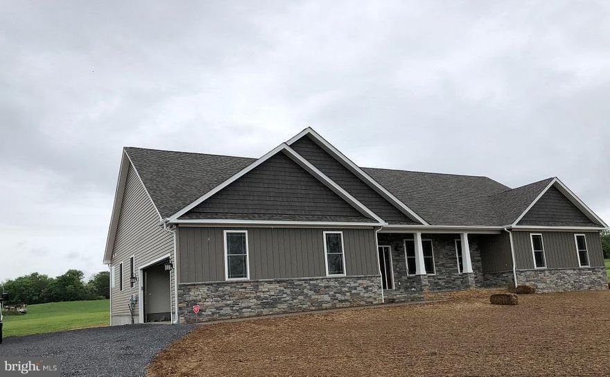 Gorgeous Custom Craftsman home. Appraisers - Lot $65000.  Upgrades include concrete free form patio surrounded by river rock, concrete pad off workshop, wet bar with shelves and cabinets, stone front, upgraded lighting, custom front door and custom hand made barn door for master. Custom stove vent. 2 gorgeous stacked stone gas fireplaces. Check out pix of Luxury Vinyl flooring.