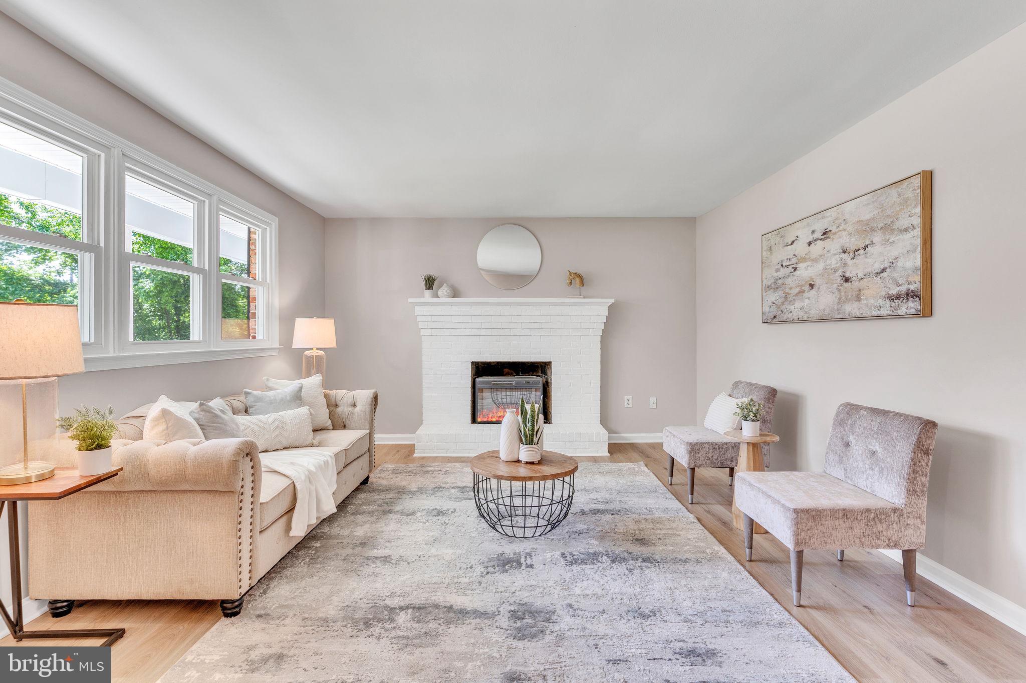 Beautifully renovated brick-front rambler with a one-car carport, brand new Septic System, brand new roof, siding, windows, gutters, and downspouts—ready for easy living! Enjoy a covered front porch and a welcoming new front door. Inside, the cozy living room features a charming brick fireplace and energy-efficient double-pane windows. The home shines with all-new light fixtures and durable LVP flooring throughout. The dining room has a lovely chandelier, and the eat-in kitchen is fully updated with new cabinets, stainless steel appliances, and a back door that opens to a level backyard with a shed. The utility room includes a new water heater, laundry sink, and space for storage and washer/dryer. You'll find three comfortable bedrooms and two beautifully renovated full baths, including a spacious owner’s suite with double closets and a private bath featuring designer tile and step-in shower. Enjoy the beach and water access at Golden Beach on a hot summer day. This home is move-in ready and thoughtfully updated from top to bottom!