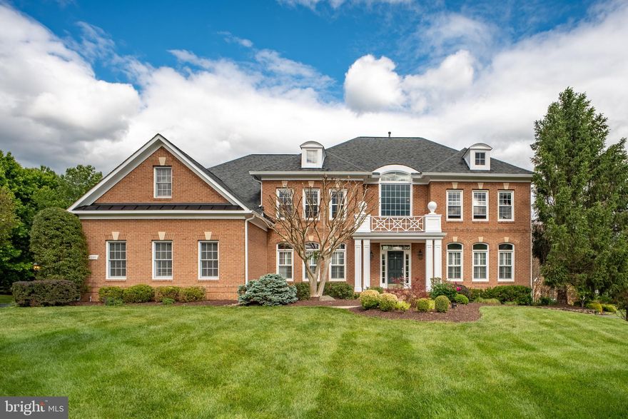 OPEN HOUSE 1pm-4pm on Saturday 5/16. Rarely available! This elegant estate home, in sought-after Manors of Fox Mill, offers 5 bedrooms, 4 full baths, and 2 half baths on a FLAT one-acre lot backing to WOODS. Combining timeless design with modern updates,this turnkey residence is ideal for both entertaining and everyday living. A stately three-side brick exterior and three-car garage create impressive curb appeal. Inside, a sweeping dual staircase welcomes you into LIGHT-FILLED living spaces with rich hardwood floors and expansive floor-to-ceiling windows. The gourmet kitchen is equipped with a 48" Sub-Zero refrigerator, a six-burner Wolf gas range, and two Miele dishwashers. The kitchen opens seamlessly to the breakfast room and sunroom, where walls of windows overlook the private backyard. The main level also includes a spacious family room with a gas fireplace, private study, and elegant formal living and dining rooms. Upstairs,the spacious owner’s suite offers a peaceful retreat with a private sitting room, spa-inspired bath, and large walk-in closet. One secondary bedroom includes a private en suite bath, while two additional bedrooms share a Jack-and-Jill bath. The walk-out lower level adds outstanding flexibility with recreation and entertainment space, plus a private fifth bedroom with walk-in closet, and full bath. Outdoor living is equally impressive, with a deck and patio with a fire pit overlooking the flat backyard. Conveniently located near Tysons, Fairfax, Reston, and Dulles, the home offers easy access to shopping, dining, and commuter routes, and all within the highly regarded Oakton High School pyramid. Exceptional combination of luxury, space, privacy, schools, and convenience. MUST SEE! Major updates include:• Primary bathroom (2016)• Kitchen (2017)• Roof (2021)•Gutters (2024)•Water Heater(2024) Second-level and basement flooring (2024)• Most windows replaced (2026)• Driveway (2026).