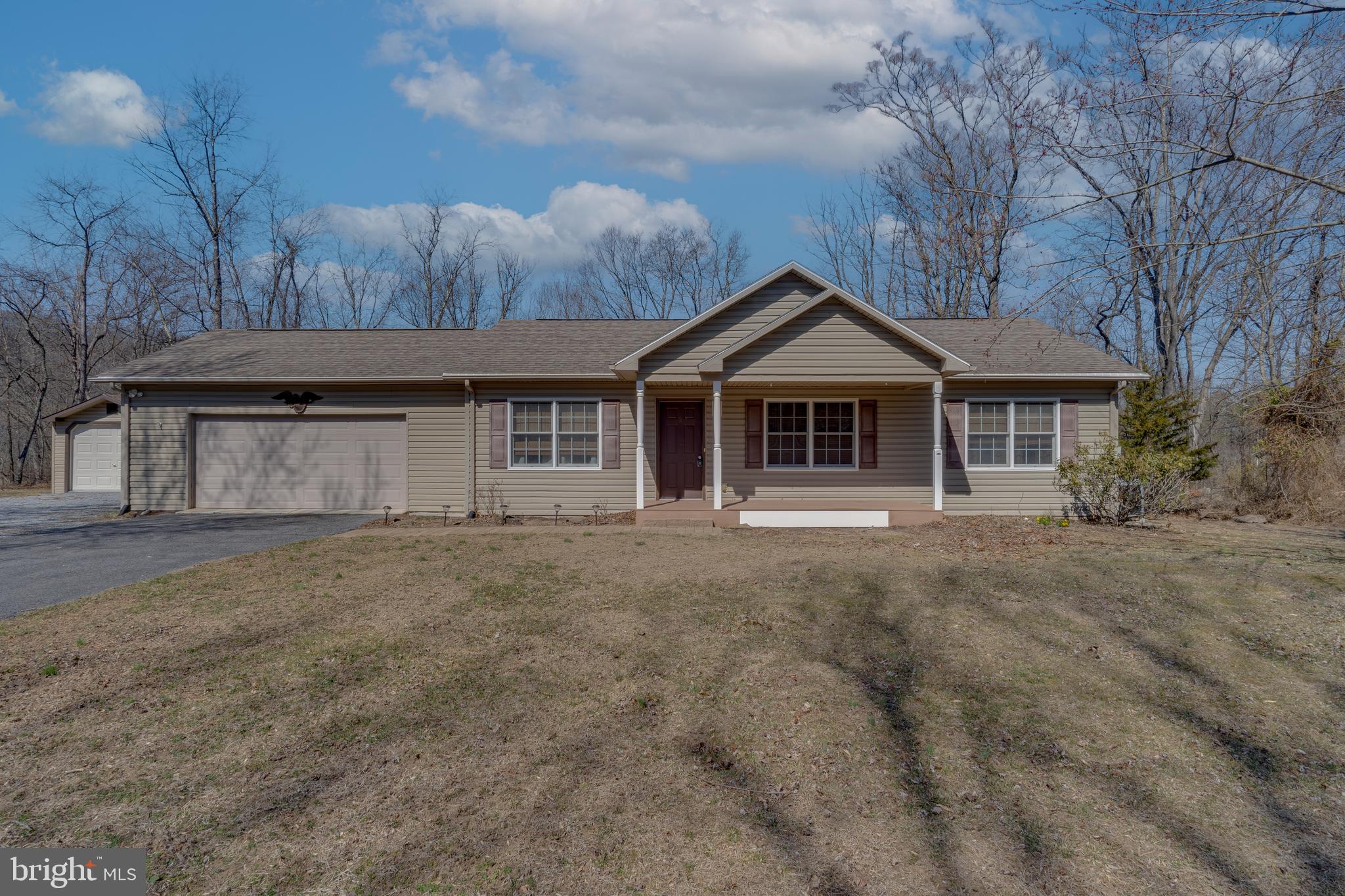 Back on the market through no fault of the seller, this charming and well-cared-for home offers the perfect blend of comfort, convenience, and small-town appeal. Enjoy peaceful, single-level living in this lovingly maintained 2-bedroom, 2-bath residence, ideally set on a private, level lot just south of historic Berkeley Springs. Known for its healing mineral waters and the George Washington Bathhouse, Berkeley Springs offers a unique blend of small-town charm, rich history, and vibrant arts culture. Explore local galleries, quaint shops, and popular dining spots—all just a short drive away.
Located right off Route 522, this home offers easy access to Berkeley Springs, Winchester, Hancock, and the new bypass. Cacapon Resort State Park is also nearby, offering golf, hiking, and natural beauty year-round. The oversized attached two-car garage and large storage shed provide practicality, while the low-maintenance layout makes everyday living a breeze. Whether you're looking for a quiet retreat or a home base close to everything this charming region has to offer, this move-in ready gem is the perfect fit for a relaxing retirement lifestyle.