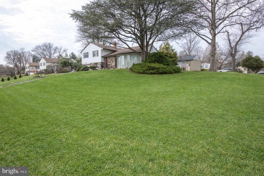 Split-level home • Huntingdon Valley • Remodeled kitchen 2016 • Gas fireplace • Pella windows • Lennox HVAC 2021 • Private patios • Walk-up attic • 0.4 mi to Lormer Park •  Shopping: 0.8 miles • Hospitals 1.2 miles • Regional rail: 1.4 miles

This beautiful corner property is located on a quiet street in Huntingdon Valley. Welcome to 1180 Ballytore Road a well-maintained split-level home offering 3 bedrooms, 2 ½ baths with garage and thoughtful updates throughout. The living room features a dramatic floor-to-ceiling bow window and a vent-free gas fireplace added in 2015, while the formal dining room enjoys garden views through an oversized window.
The kitchen was fully rebuilt to the studs in 2016 and includes 42-inch custom cabinetry, a granite peninsula, Pergo flooring, recessed lighting, and a sliding glass door opening to a private rear patio surrounded by mature landscaping. Steps connect to a lower patio off the family room, creating an easy indoor-outdoor flow.
Upstairs, the primary bedroom offers dual closets and a private bath, joined by two additional bedrooms with ceiling fans, newer doors, and custom built-ins for storage or workspace. A full hall bath with vanity and tub serves the additional bedrooms. Hardwood floors are present beneath carpeting on the first and second levels. A walk-up attic provides convenient storage or future flexibility.
The lower level adds versatile living space with a family room, updated powder room, exterior access to the backyard, and a carpeted utility area with washer and dryer(2021), leading directly to the attached garage.
Notable upgrades include Pella windows in 2016, a Lennox gas HVAC system in 2021, a roof with custom gutters and downspouts in 2017 with a 30-year warranty, a 200-amp electric panel replaced in 2015, a 40-gallon hot water heater in 2020, driveway excavation in 2016, Pulse custom alarm system in 2016, automatic outdoor sprinkler system, and an outdoor storage shed.
Conveniently positioned approximately 0.4 miles from Lormer Park, 0.8 miles from shopping, 1.2 miles from hospitals, and 1.4 miles from regional rail, this home combines thoughtful updates with a practical layout in a desirable Huntingdon Valley setting.