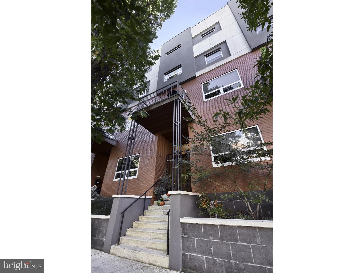 Quality craftsmanship and stunning details are the hallmarks of this Kings Court residence in the Logan Square neighborhood of Philadelphia. This three bedroom, three and a half bathroom commands the south side of tree-lined Race Street. Features of this exceptional residence include a luxurious third floor master suite, a state-of-the-art gourmet kitchen and three balconies to take in the city views. Step inside the grand foyer offering beautiful Brazilian hardwood flooring that continues throughout the home. A private home office off of the foyer, complete with a walk-in closet, can easily be a library, den, or fourth bedroom. Continue into the open concept living area where a vaulted ceiling and floor-to-ceiling south facing glass doors create an inviting atmosphere. Prepare meals in the incredible gourmet kitchen surrounded by black granite countertops and stainless steel appliances including a Miele dishwasher, Wolf commercial range and Sub-Zero refrigerator. An oversized pantry and designer wood cabinetry keep all of your cooking essentials organized. Enjoy meals at the breakfast bar or in the formal dining area. Entertain around the cozy double-sided fireplace in the living room or invite guests to join you outside on the low-maintenance composite deck. Unwind on the mezzanine level complete with double glass doors leading out to a lovely balcony overlooking the tree-lined street. This space can easily be a den, media room or game room. The second level features two generous sized guest suites offering excellent closet space and designer bathrooms including a floating vanity. Relax around the fireplace in the sunken family room where sunlight pours in through floor-to-ceiling windows. A convenient wet bar features a granite countertop and custom tile backsplash. The top floor owner's suite is a masterpiece filled with fine details and custom accents. Take in the city views any time of day from the private balcony or unwind in the whirlpool tub and walk-in steam shower. Dual floating vanities, a bidet, and Jerusalem tile complete the master bath. French doors lead to the dressing room outfitted with wardrobe storage, a seating area and beverage refrigerator. The lower level offers a four-car garage complete with access to the private elevator servicing every floor of this home. Steps from it all, Rittenhouse Square Park, The Barnes, Schuylkill banks, Trader Joe's, Whole Foods, Coffee shops, 30th Street station just to list a few