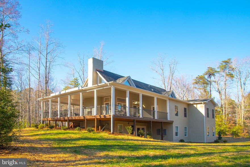 This exquisite 5-bedroom, 5-full bath, and 2-half bath residence was custom-built in 2019 and is located in an exceptional Ivy neighborhood in the Meriwether Lewis Elementary School District on Owensville Road.
The home boasts ample living space, abundant natural light, top-quality finishes and materials, and an array of impressive features. The open floor plan on all levels makes this home so very functional and its unique features like cathedral and vaulted ceilings, hardwood floors, and a magnificent 2-story wood-burning fireplace make it really enjoyable.
The fully loaded chef's kitchen includes stainless steel appliances and flows seamlessly into the main living area. The main level also includes a spacious owner’s suite with a private deck, double vanities, a large walk-in shower, and a walk-in closet.
 All bedrooms are generously sized and include en-suite bathrooms. The second level features a versatile loft space with a private deck and a half bath. The fully finished lower level features a wood stove, kitchenette, ample storage, and more.
Enjoy the outdoors on the huge, covered wrap-around deck with an outdoor fireplace. The property sits on a 2-acre lot conveniently located to Charlottesville, UVA, and Crozet, and is just around the corner from Meriwether Springs Vineyard and Brewery.